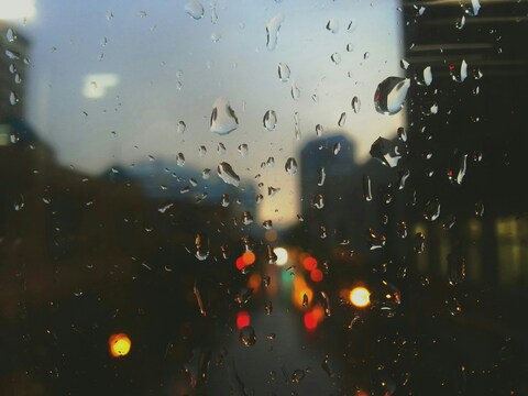 Rainy City View Through Window