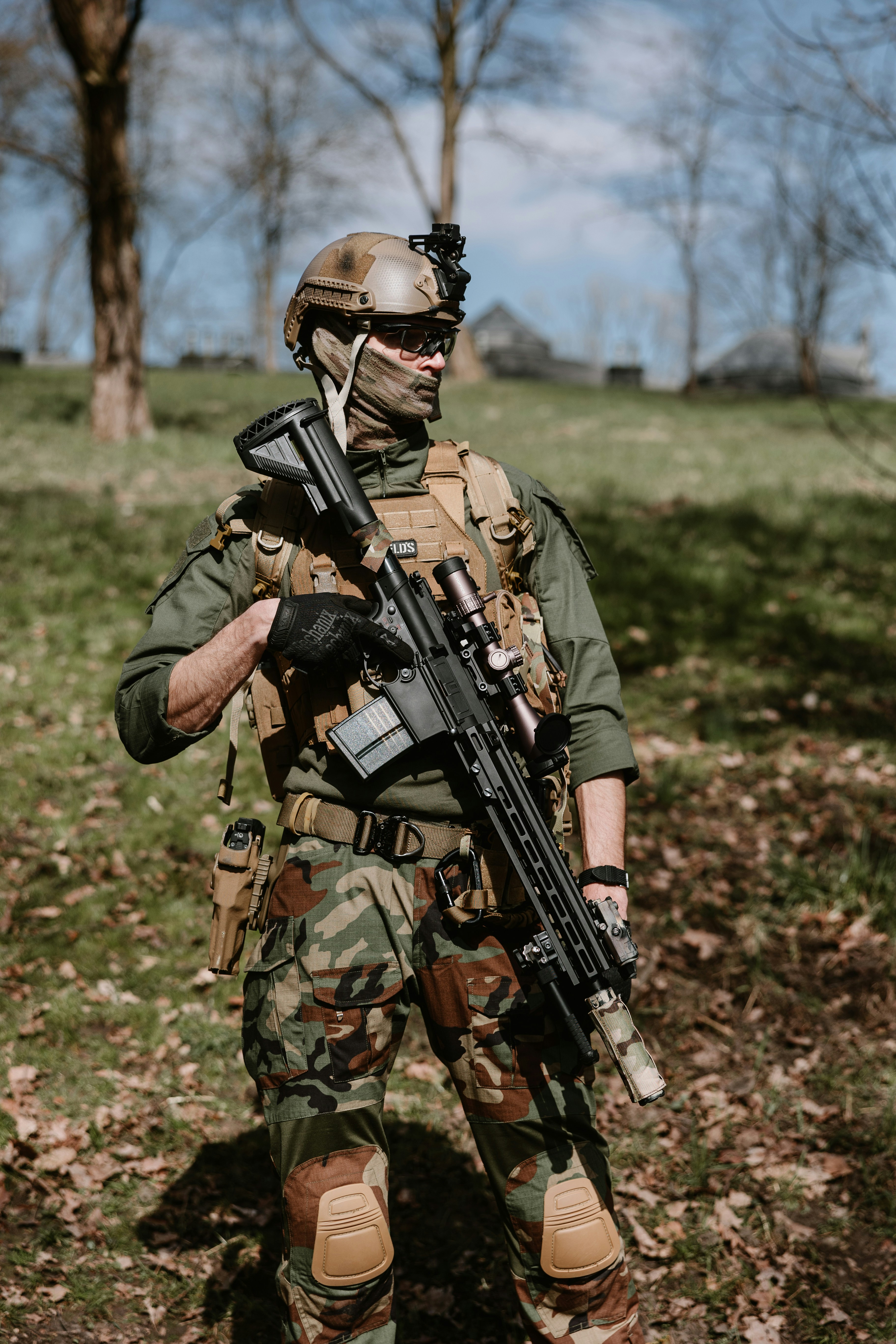 Tactical Operator Standing in Grassy Field