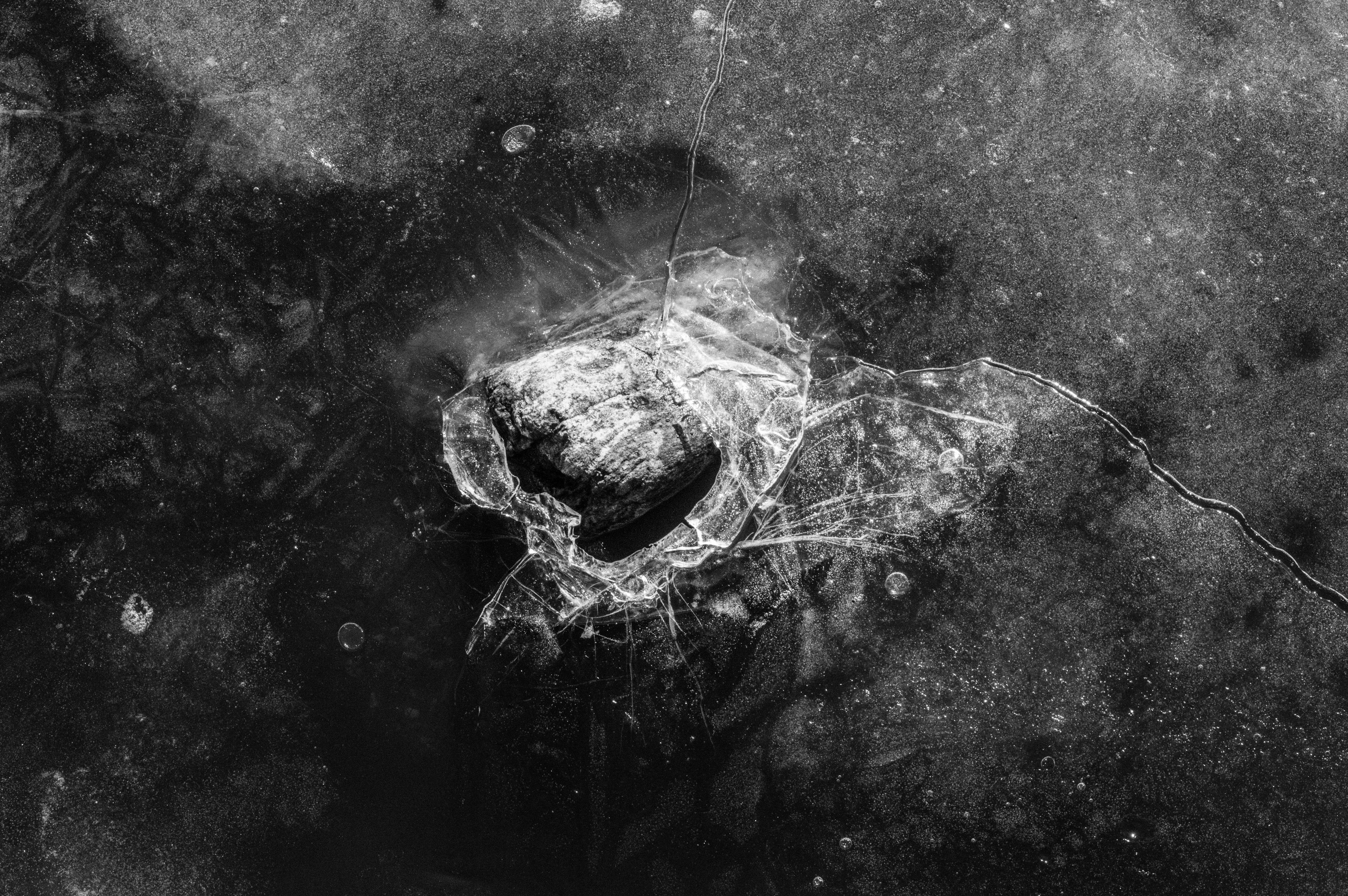 Rock Enclosed in Cracked Ice