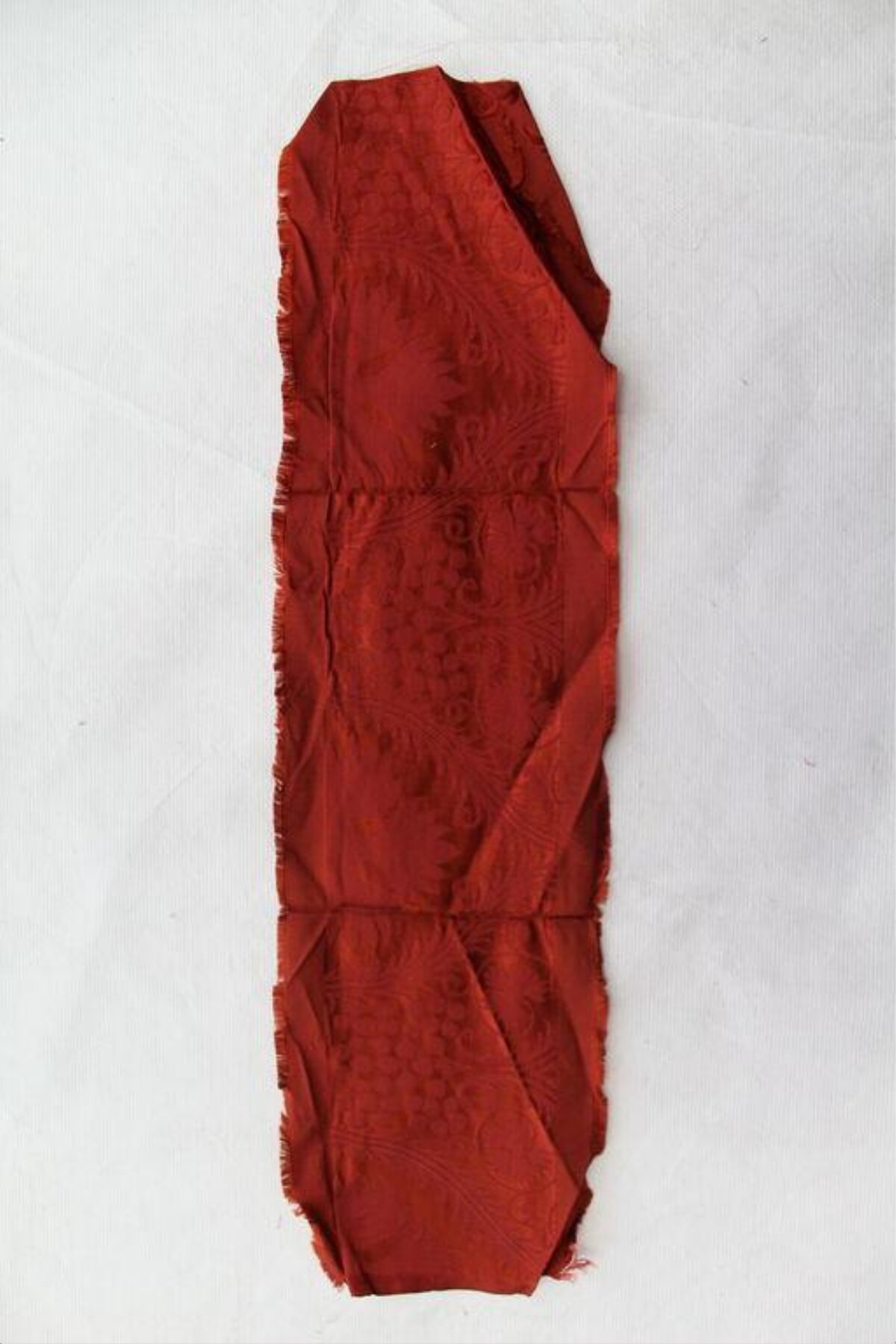 Folded Red Patterned Fabric Scrap