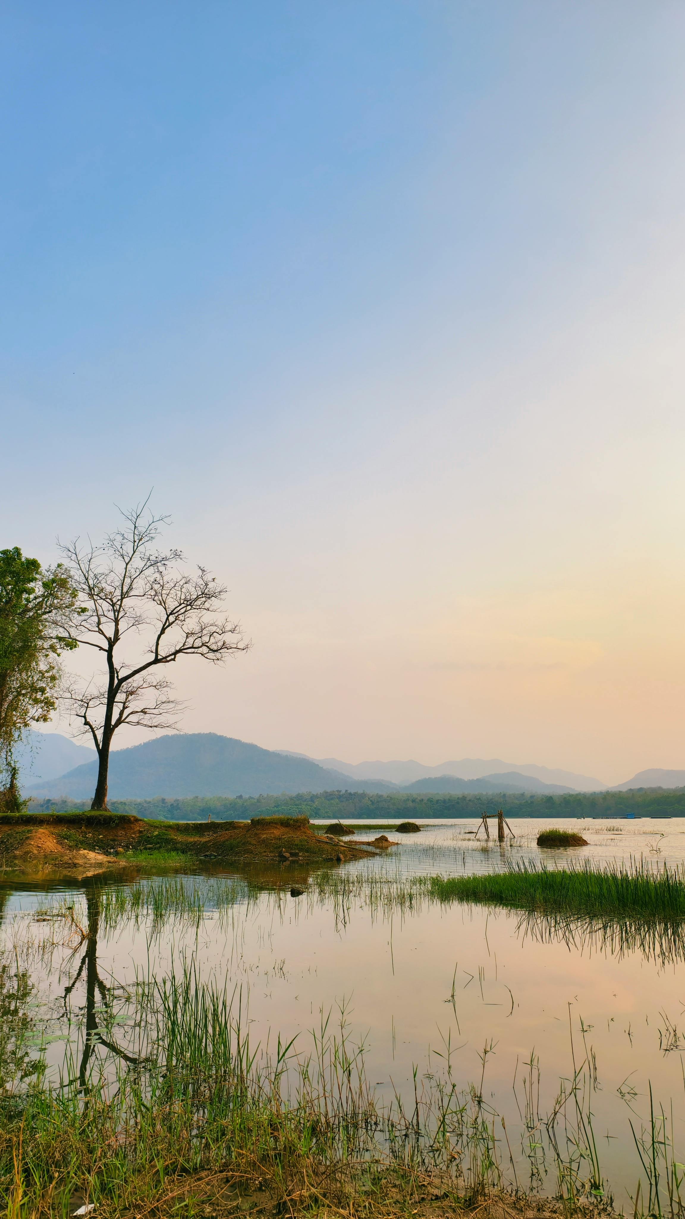 Calm Lake and Distant Mountains