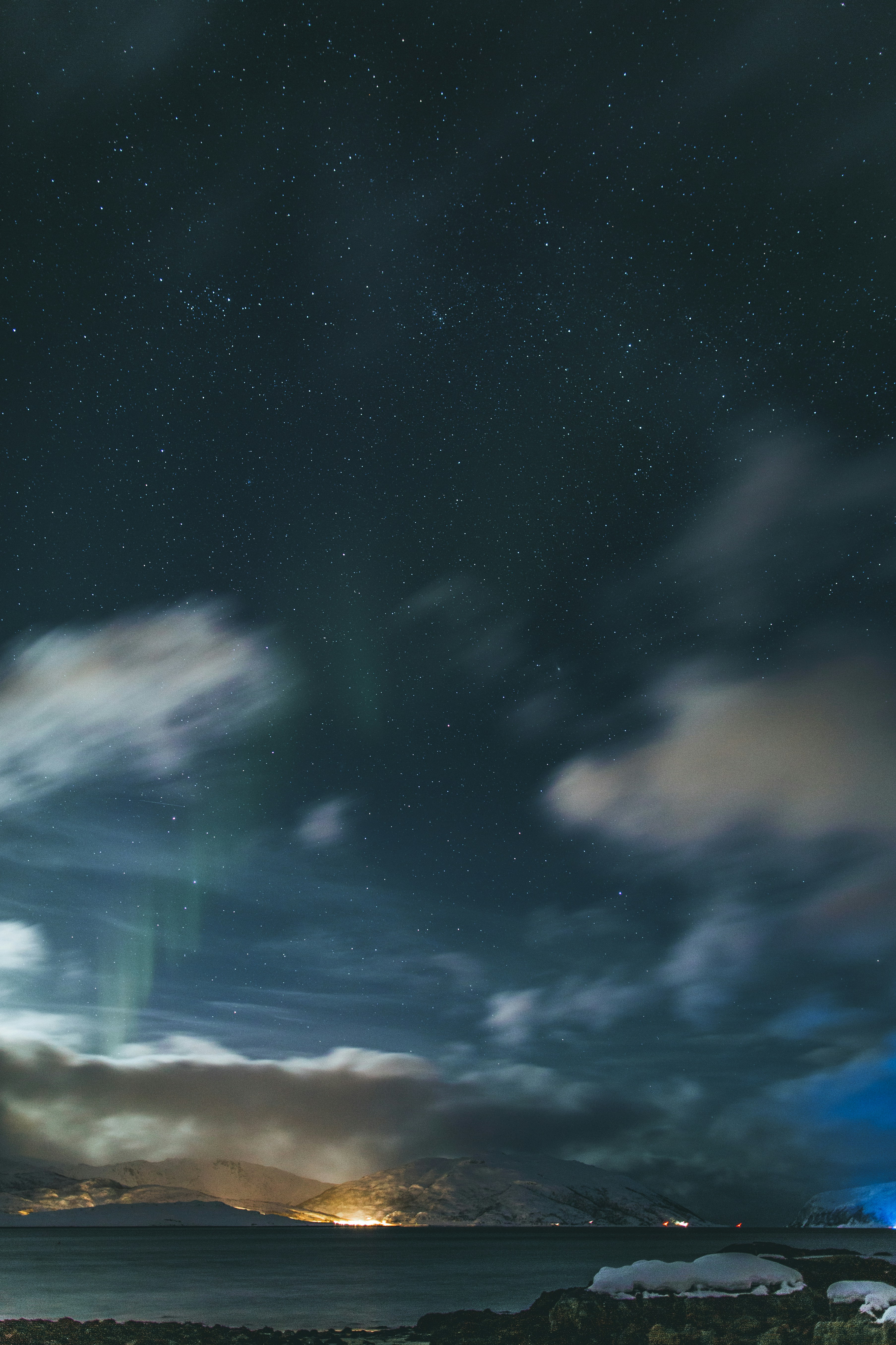 Starry Night Aurora over Snowy Coast