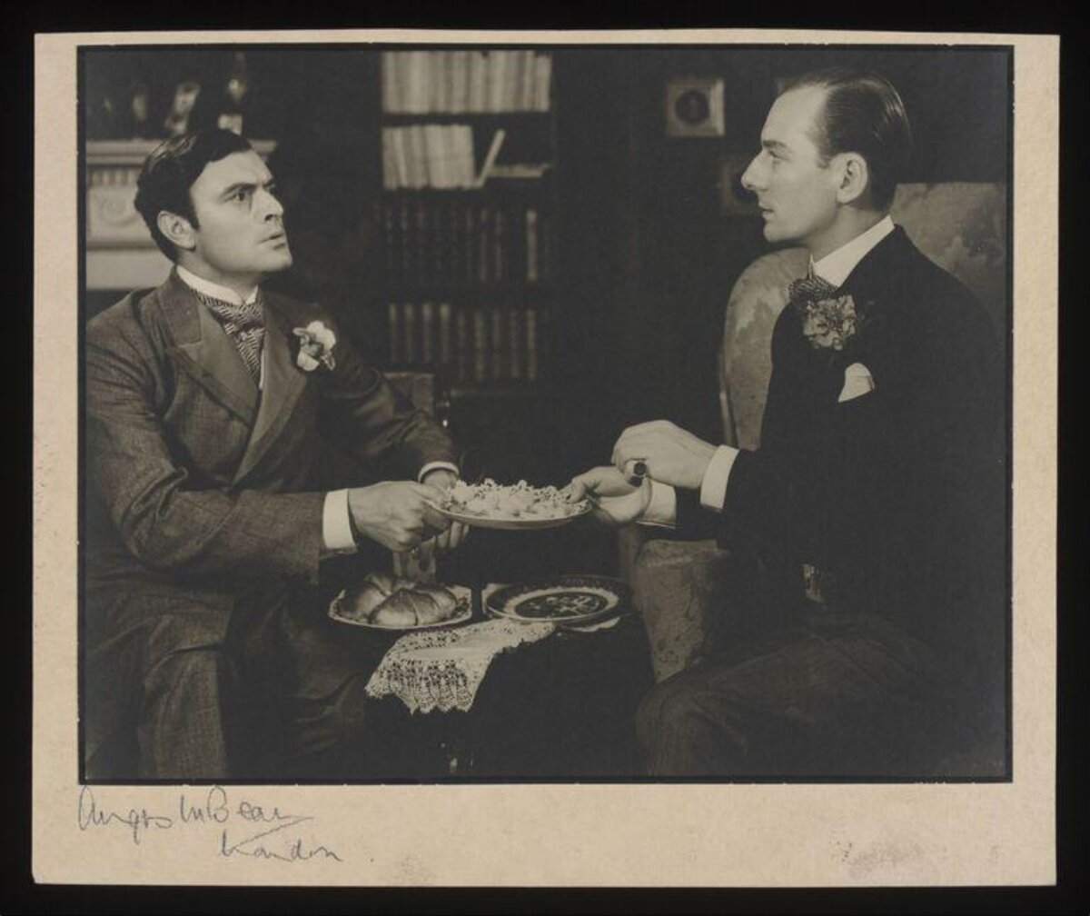 Vintage Photo Of Two Men Passing Plate