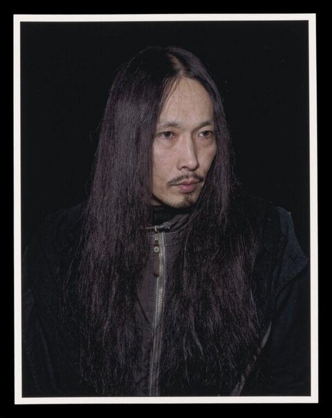 Portrait of Long-haired East Asian Man