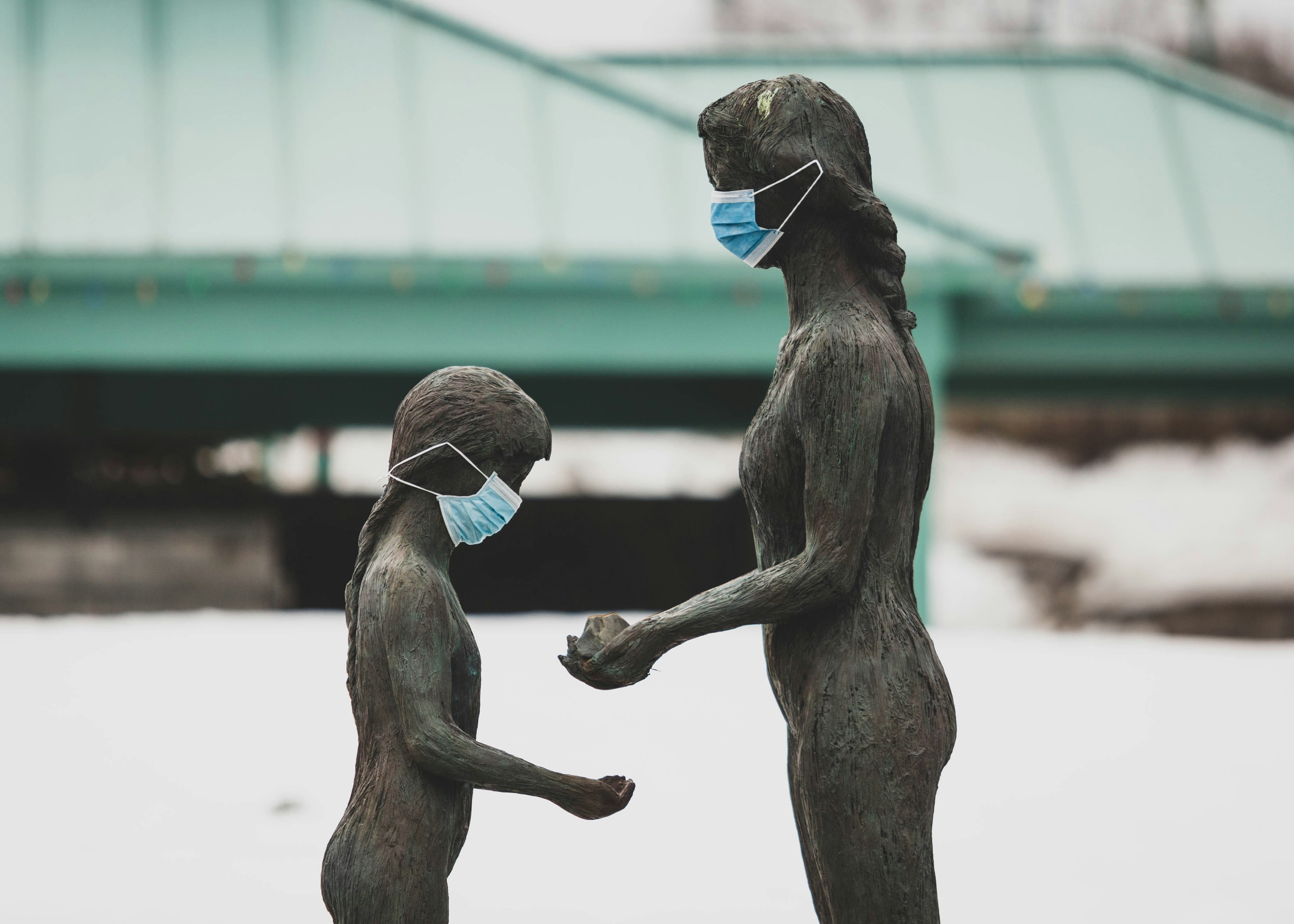 Two Masked Statues in Snow