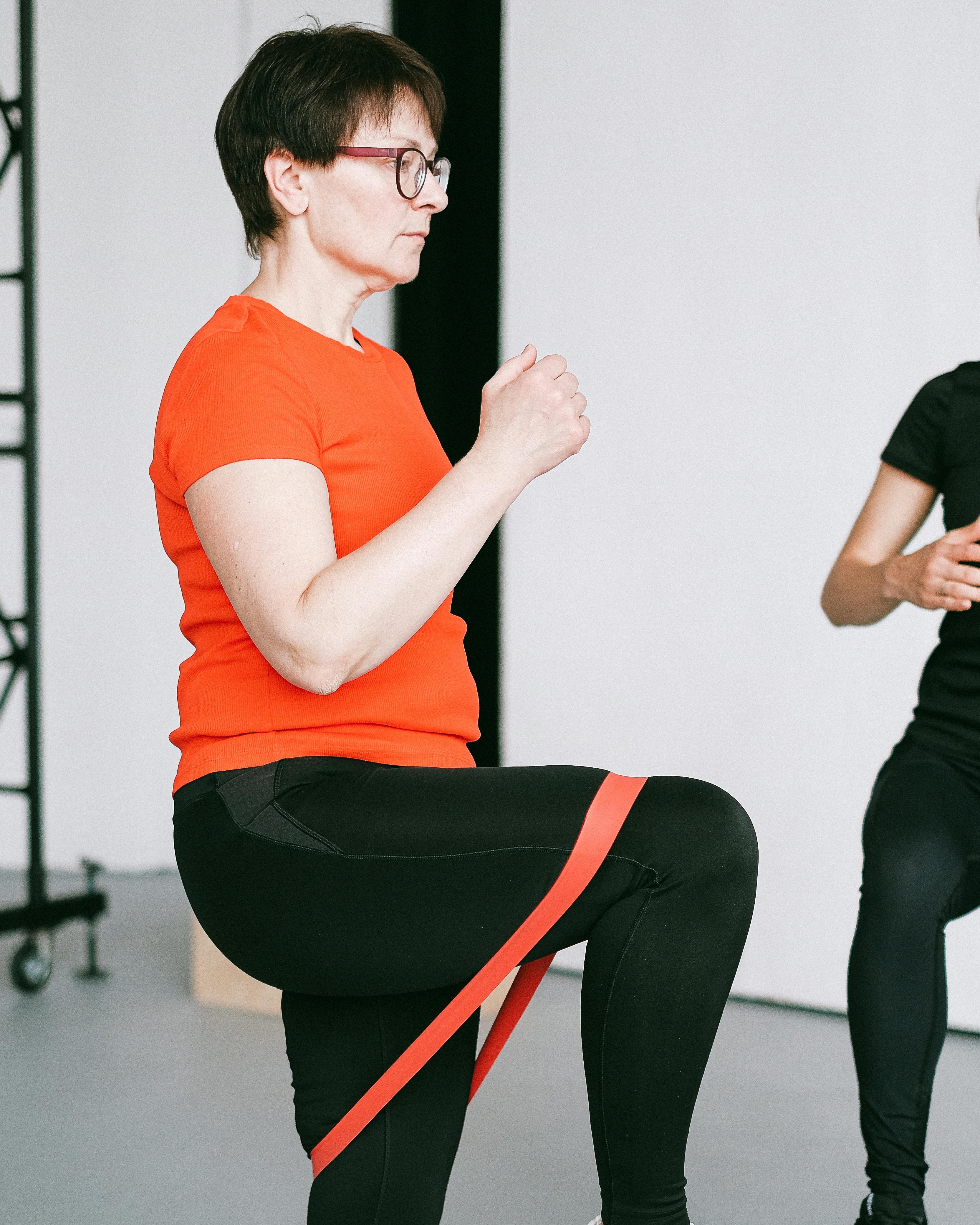 Woman Exercising With Resistance Band