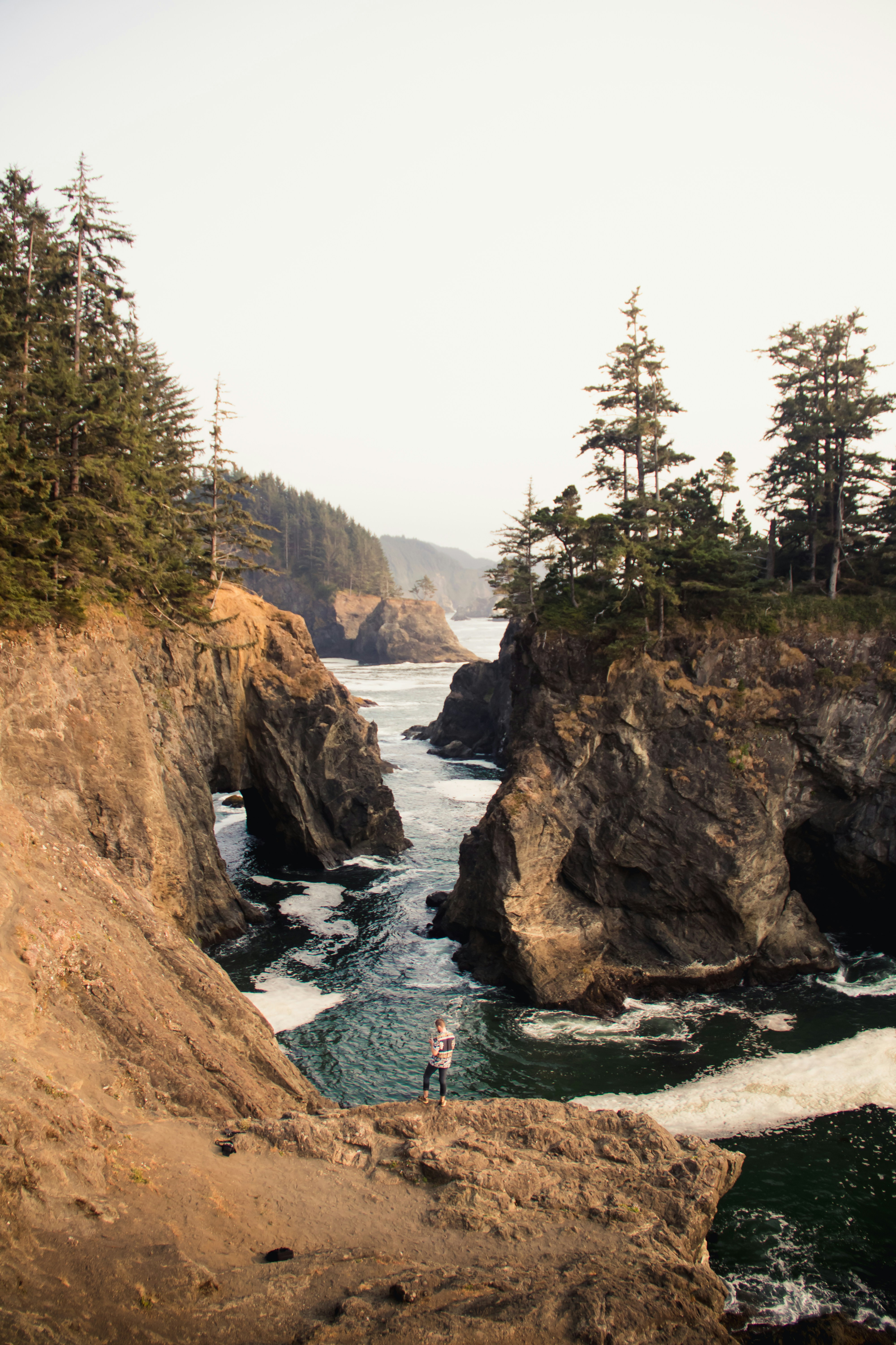 Hiker Overlooking Coastal Sea Cliffs