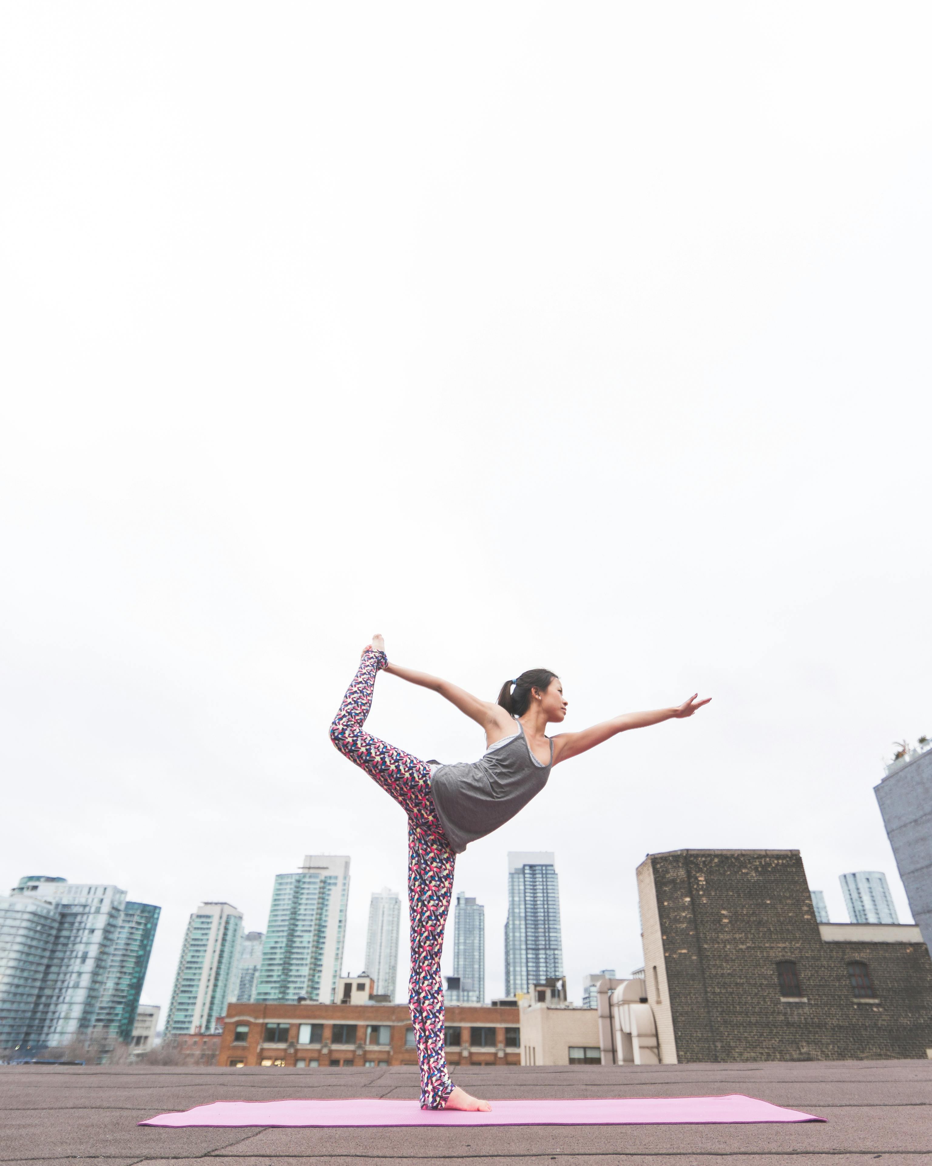 Woman Doing Yoga on Rooftop