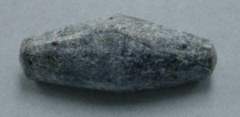 Speckled Elongated Stone Artifact