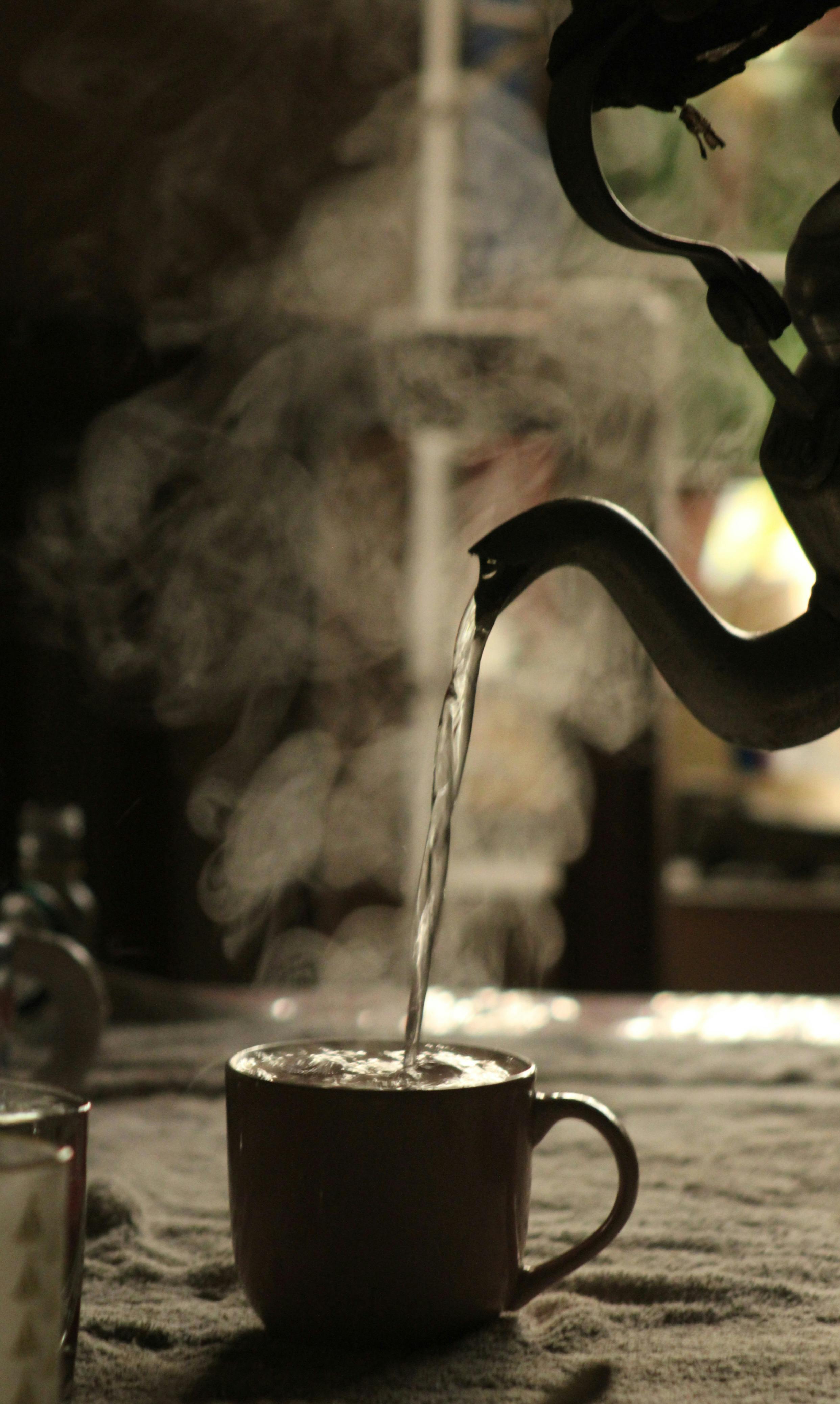 Pouring Hot Water into Coffee Mug