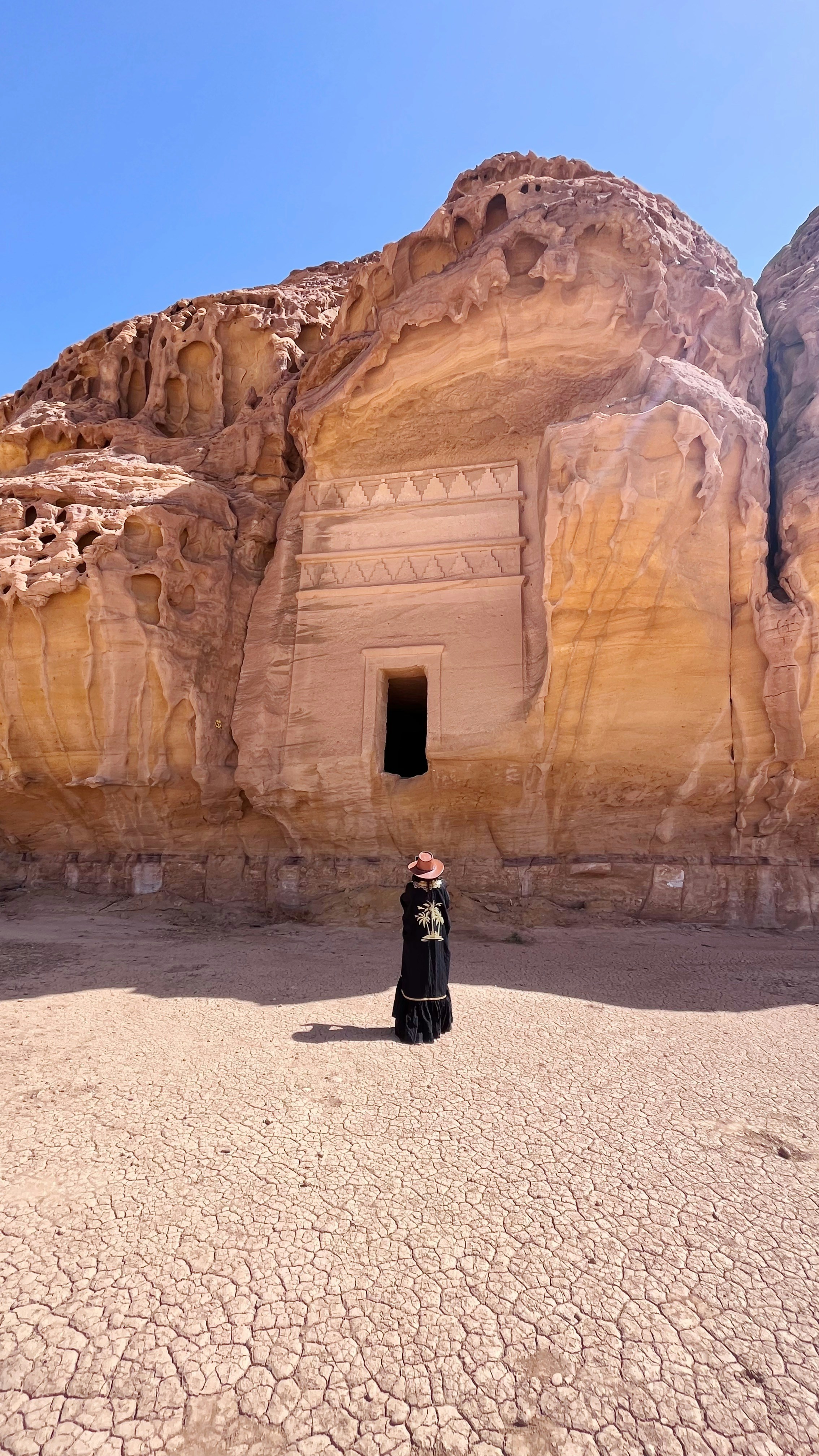 Woman Before Ancient Desert Rock Tomb