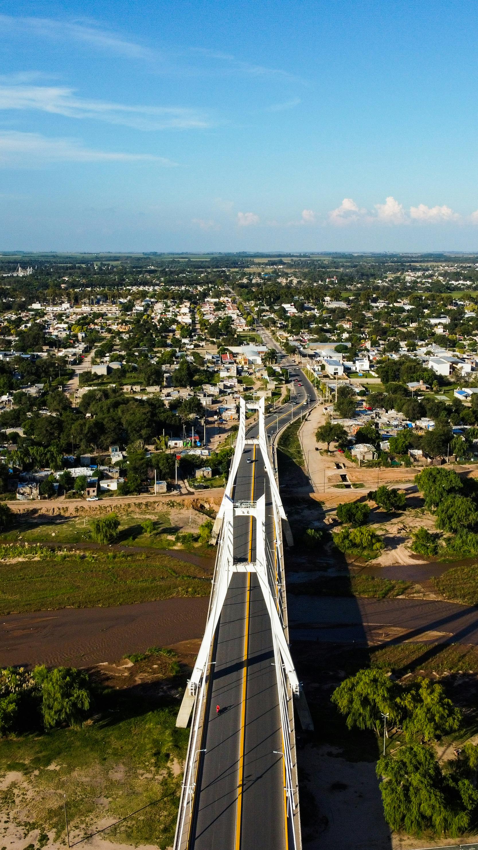 White Bridge Over River to Small Town