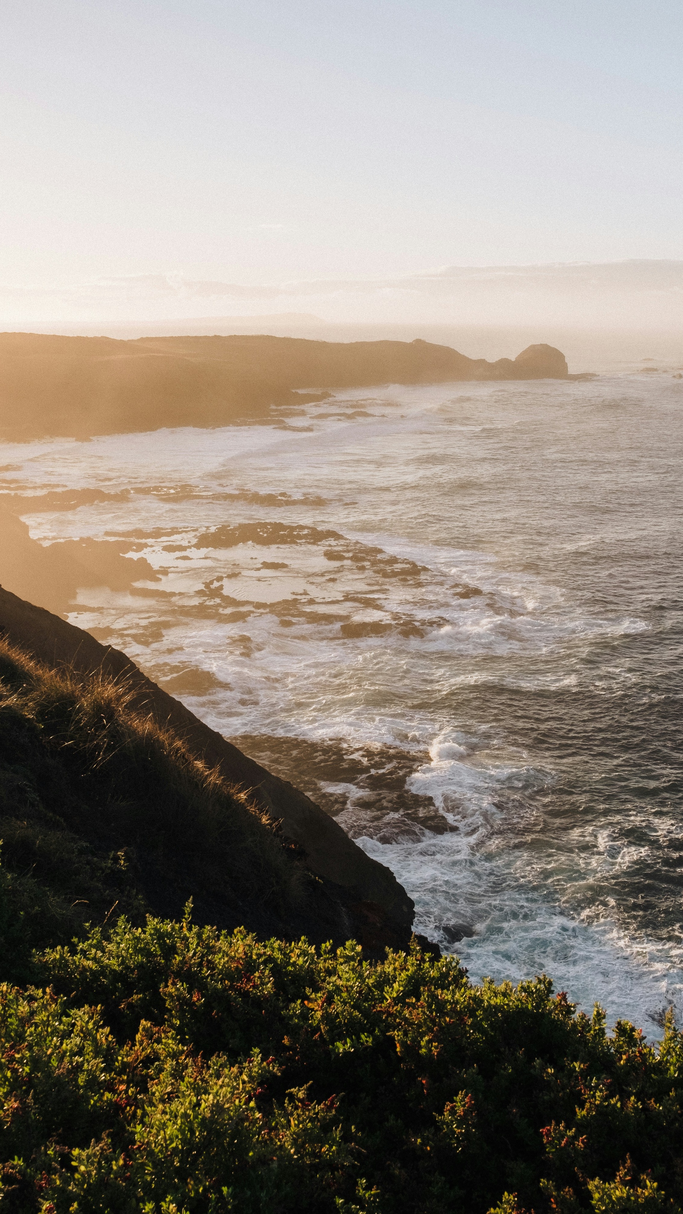 Sunlit Coastal Cliff Seascape