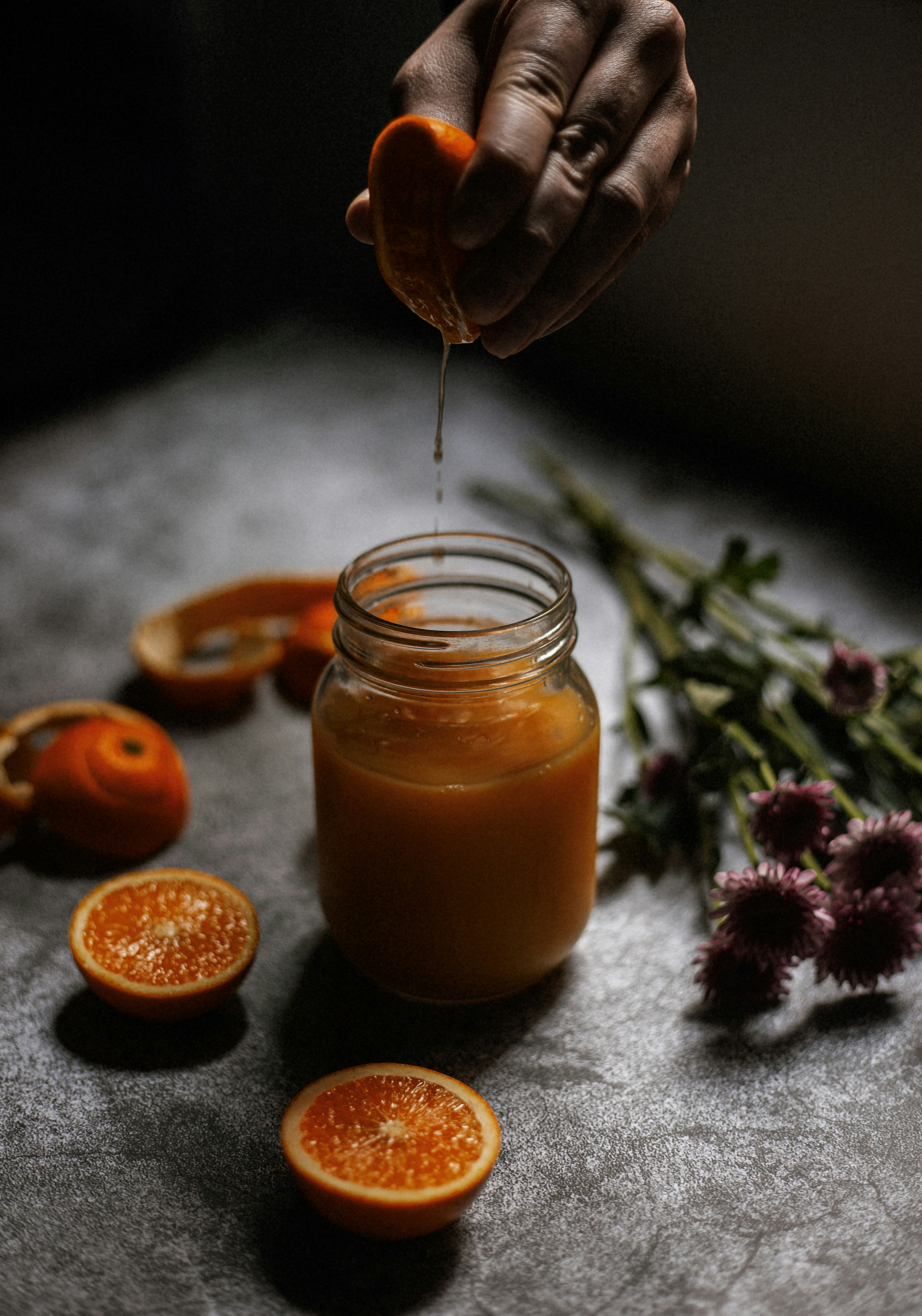 Hand Squeezing Fresh Orange Juice