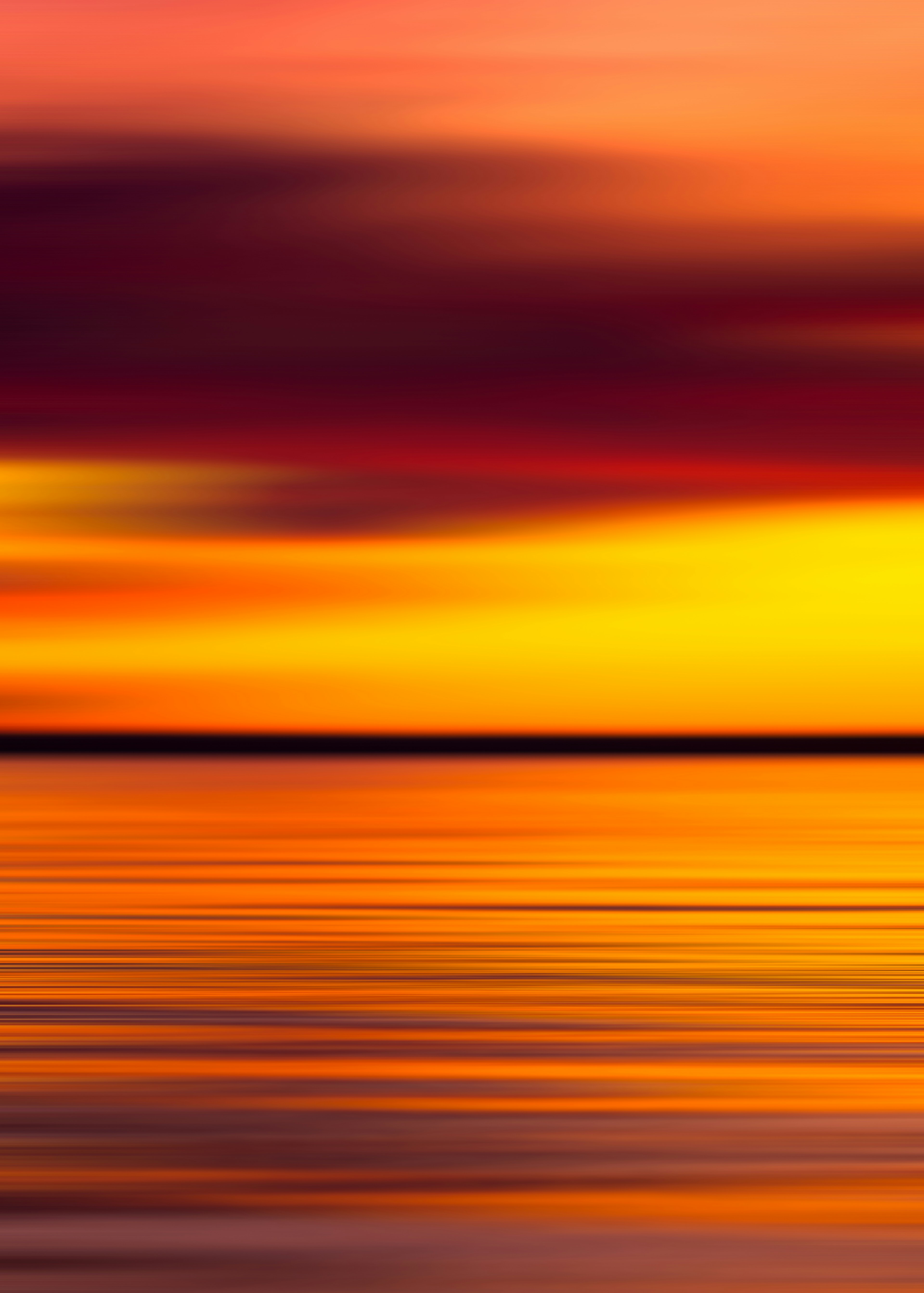 Blurred Sunset Over Calm Water