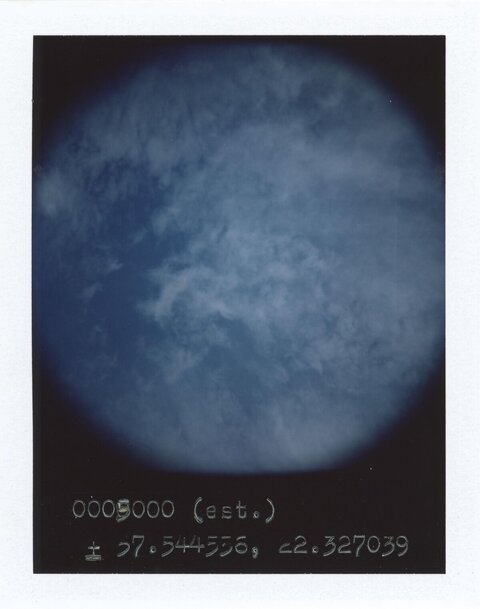 Cloudy Sky with Handwritten Coordinates
