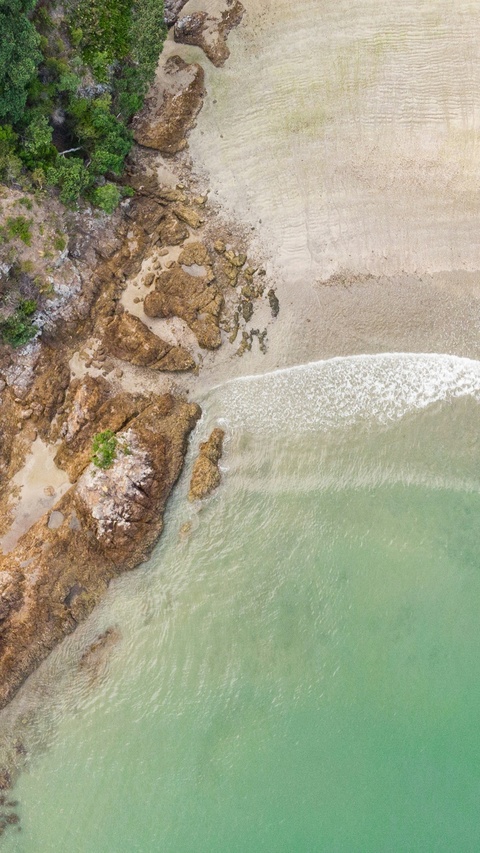 Aerial View of Rocky Coastline Beach