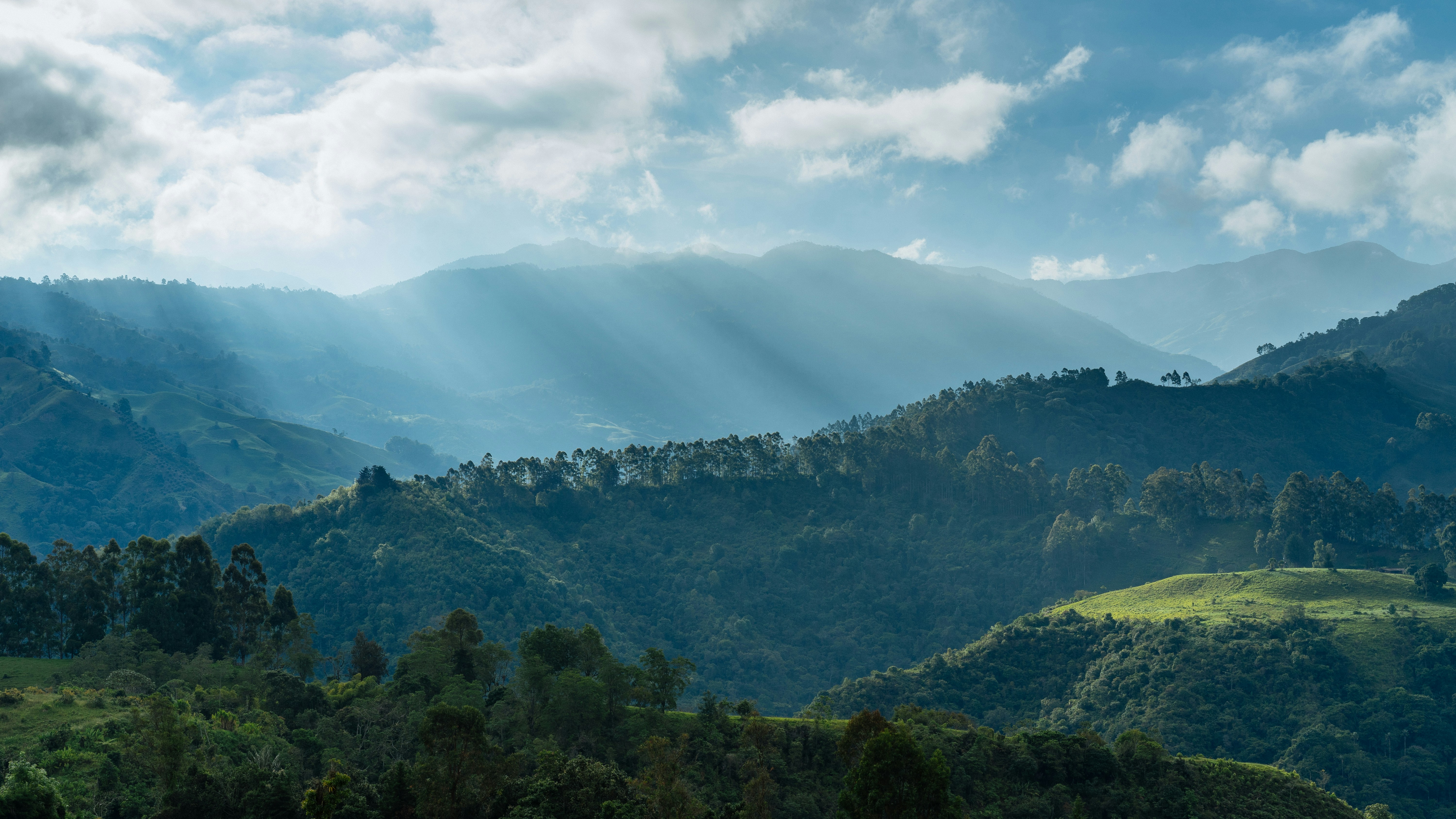 Layered Mountain Hills with Sunbeams