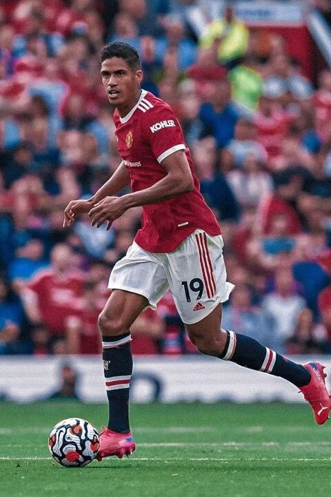 Raphael Varane Dribbling Soccer Ball on Pitch