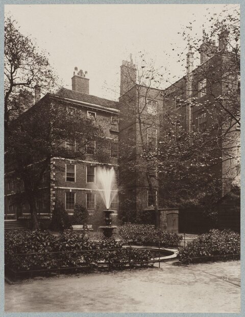 Old Courtyard Fountain and Brick Building
