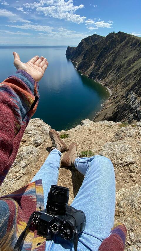 First Person View From Cliff Over Blue Lake