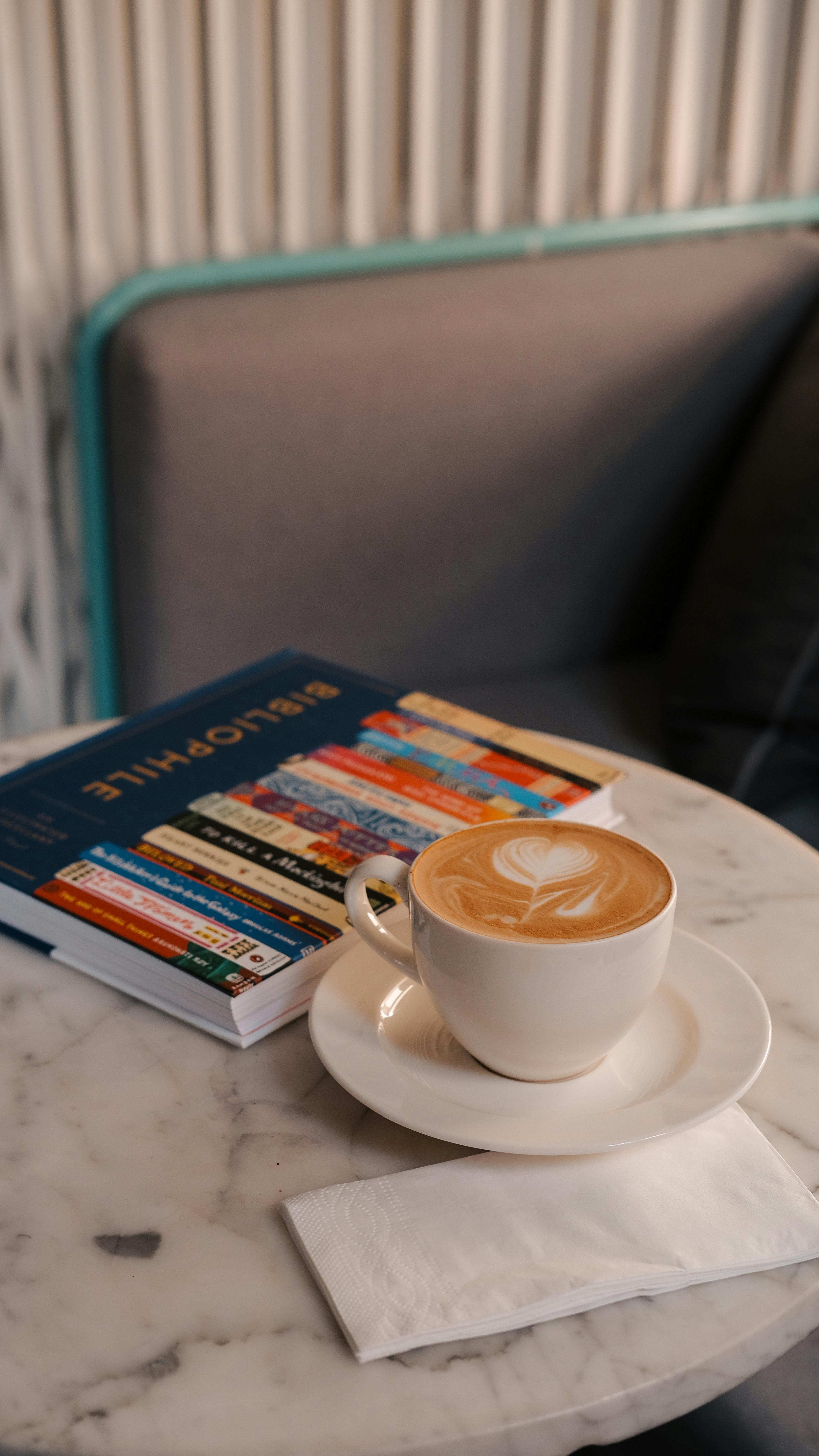 Coffee and Book on Cafe Table