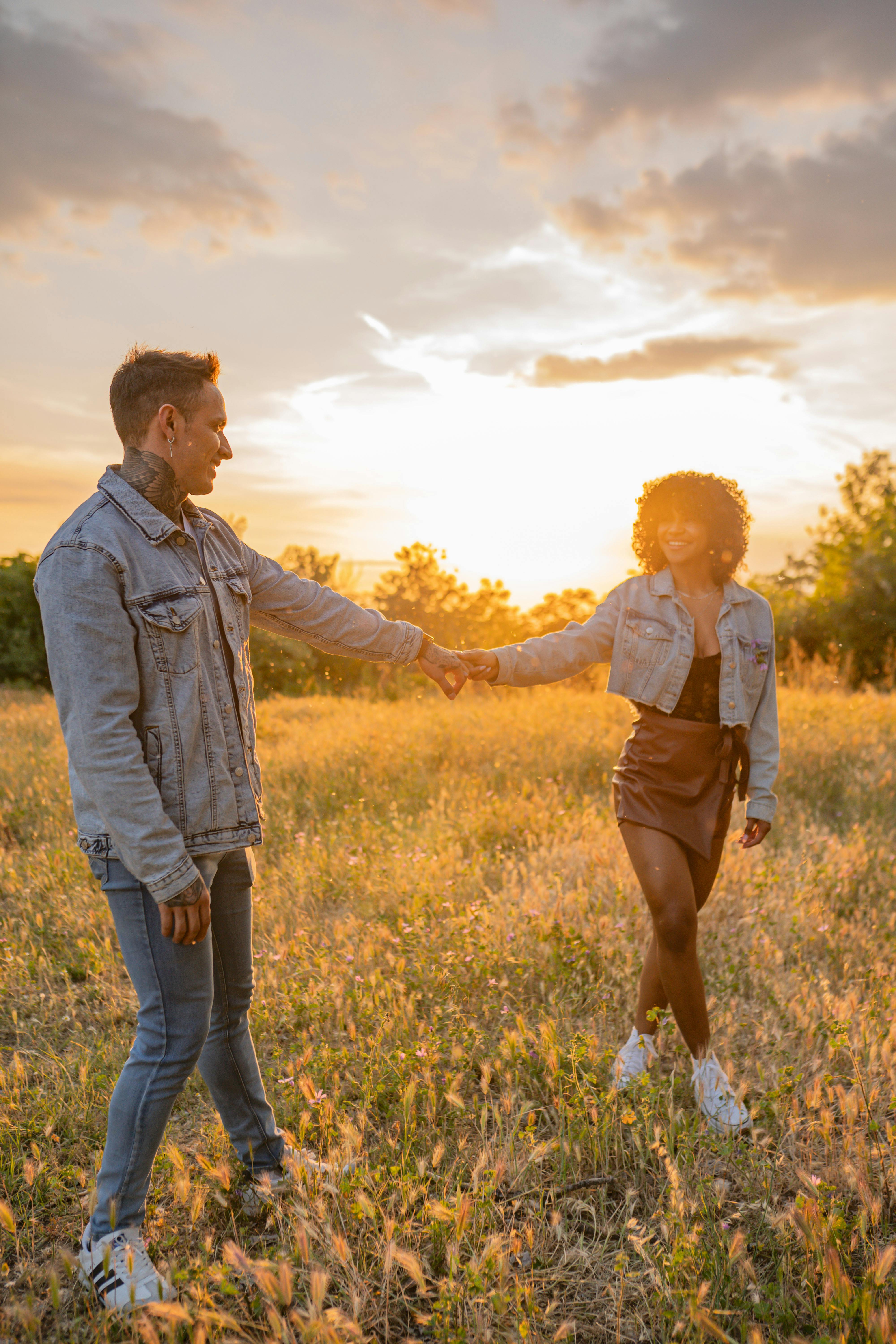 Couple Holding Hands At Sunset