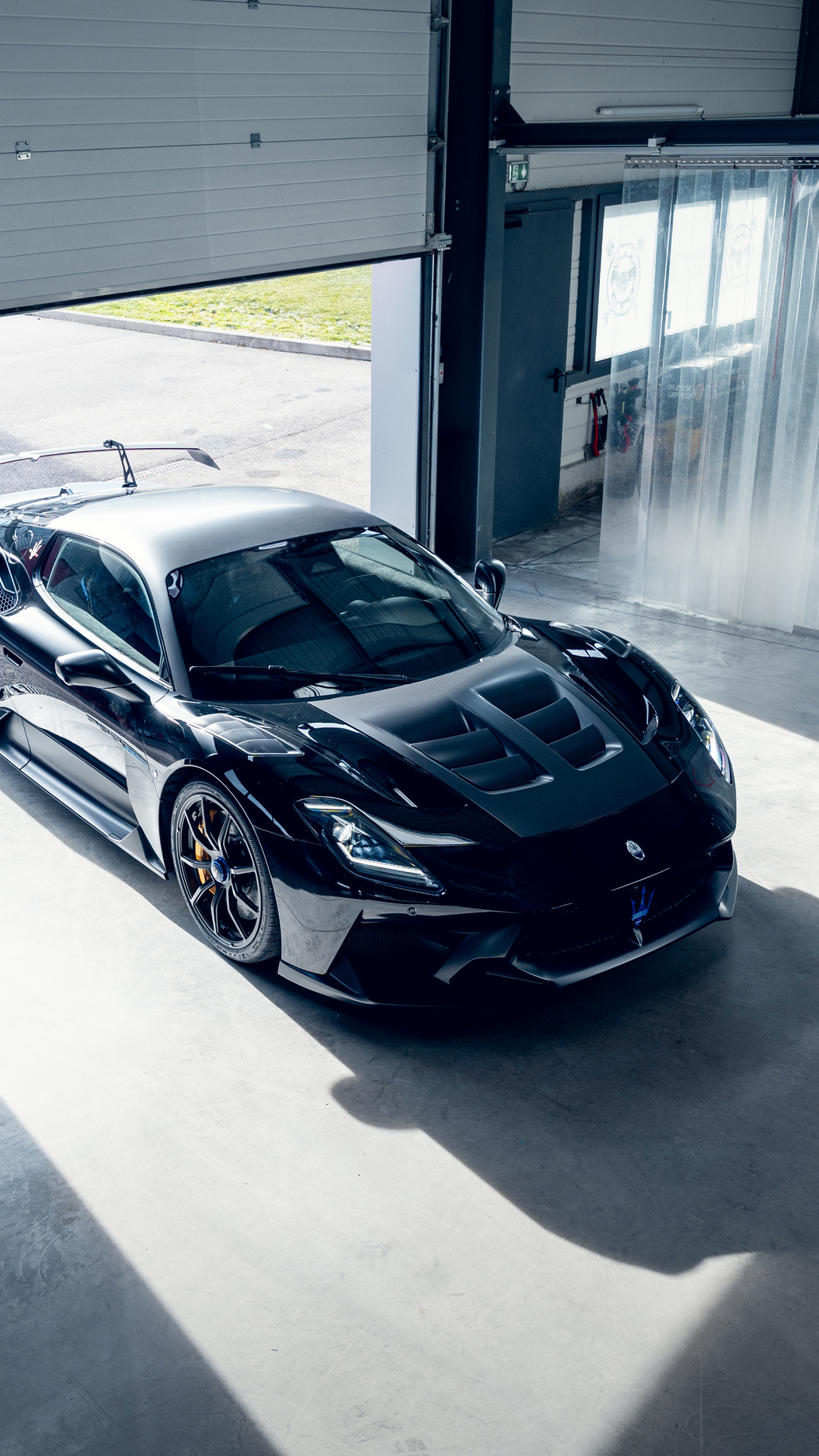 Black Maserati Sports Car in Garage