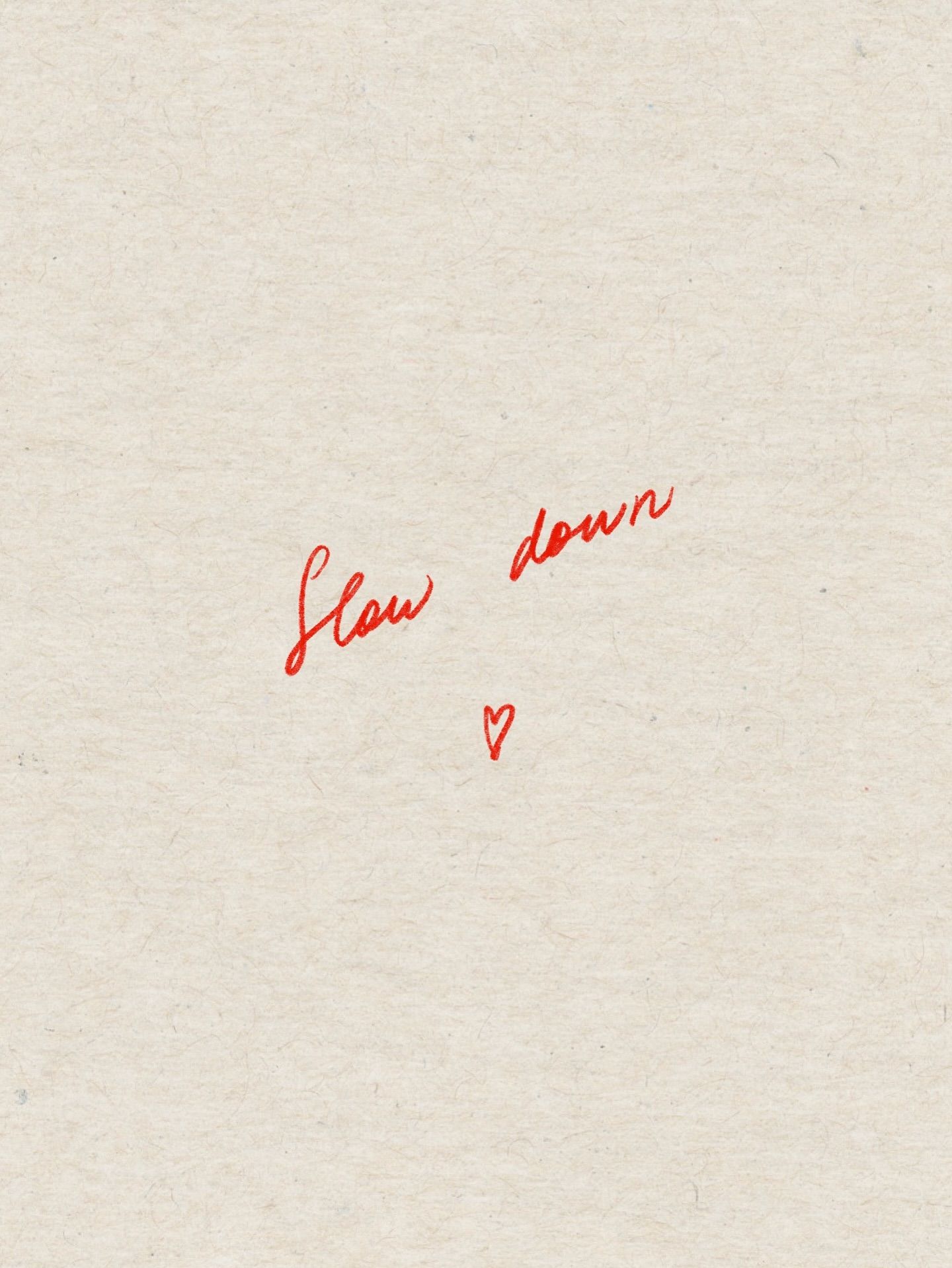 Handwritten Slow Down Text on Paper