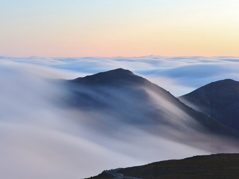 Mountain Peaks Above Sea of Clouds