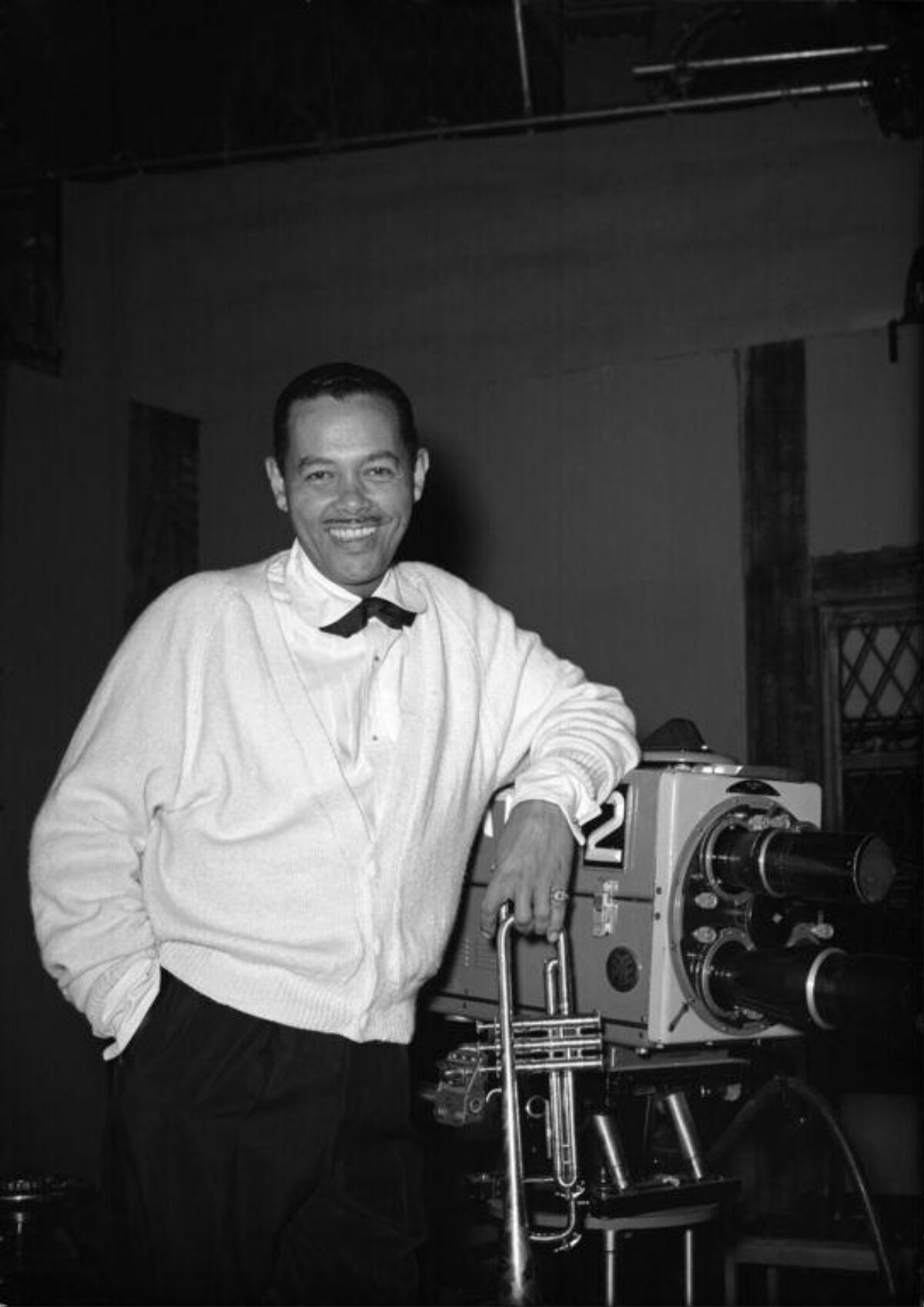 Jazz Musician With Trombone By Studio Camera