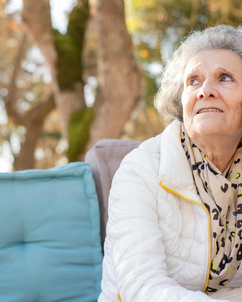 Elderly Woman Looking Up Outdoors