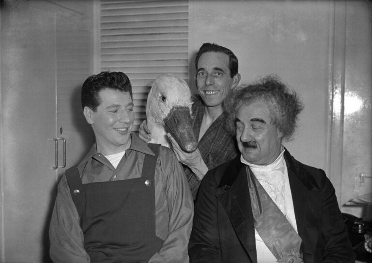 Three Actors With Duck Prop Backstage