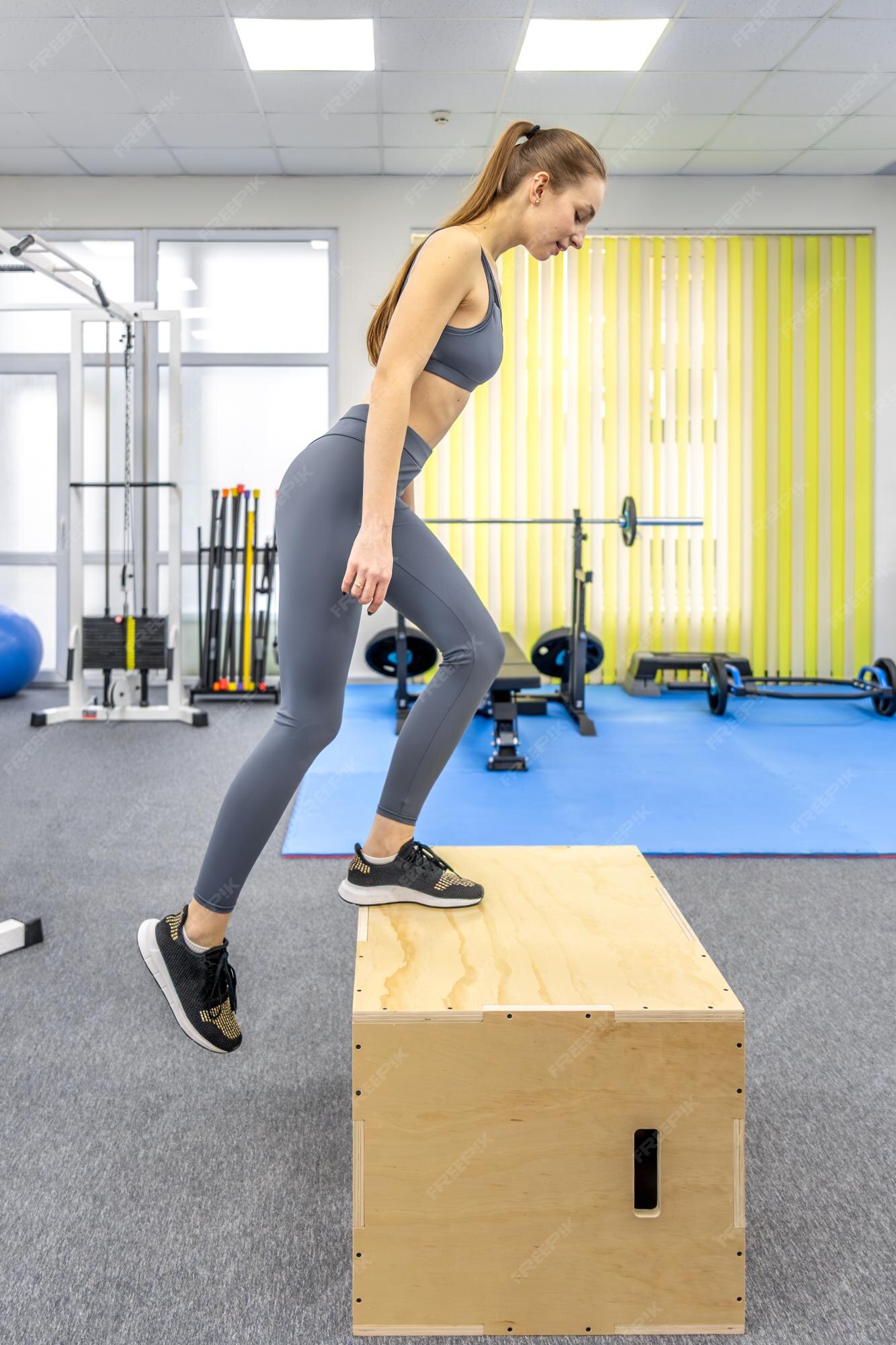 Woman Doing Box Step Up in Gym