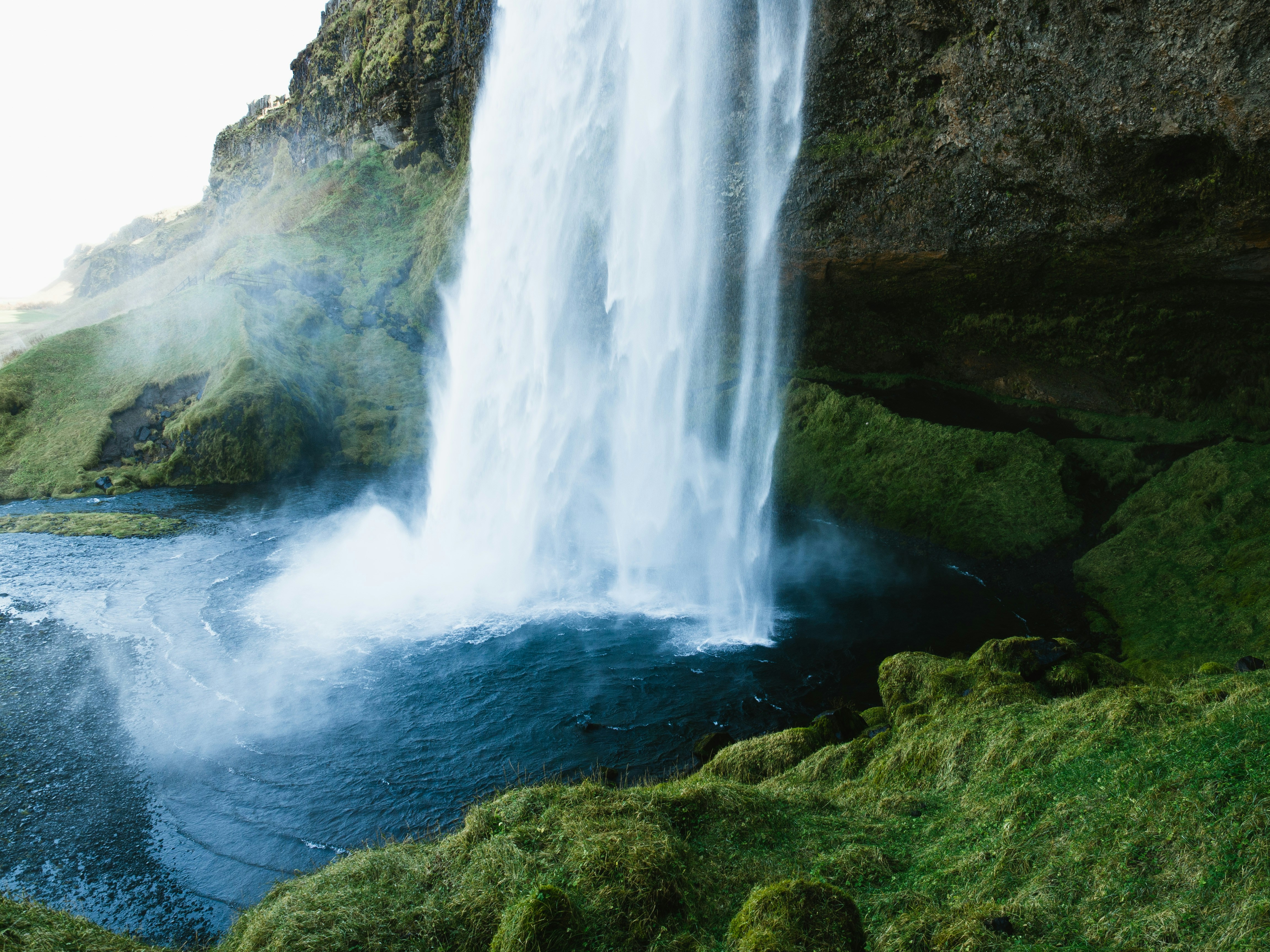 Cascading Waterfall Into Blue Pool