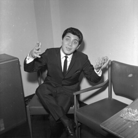 Young Man Gesturing While Seated