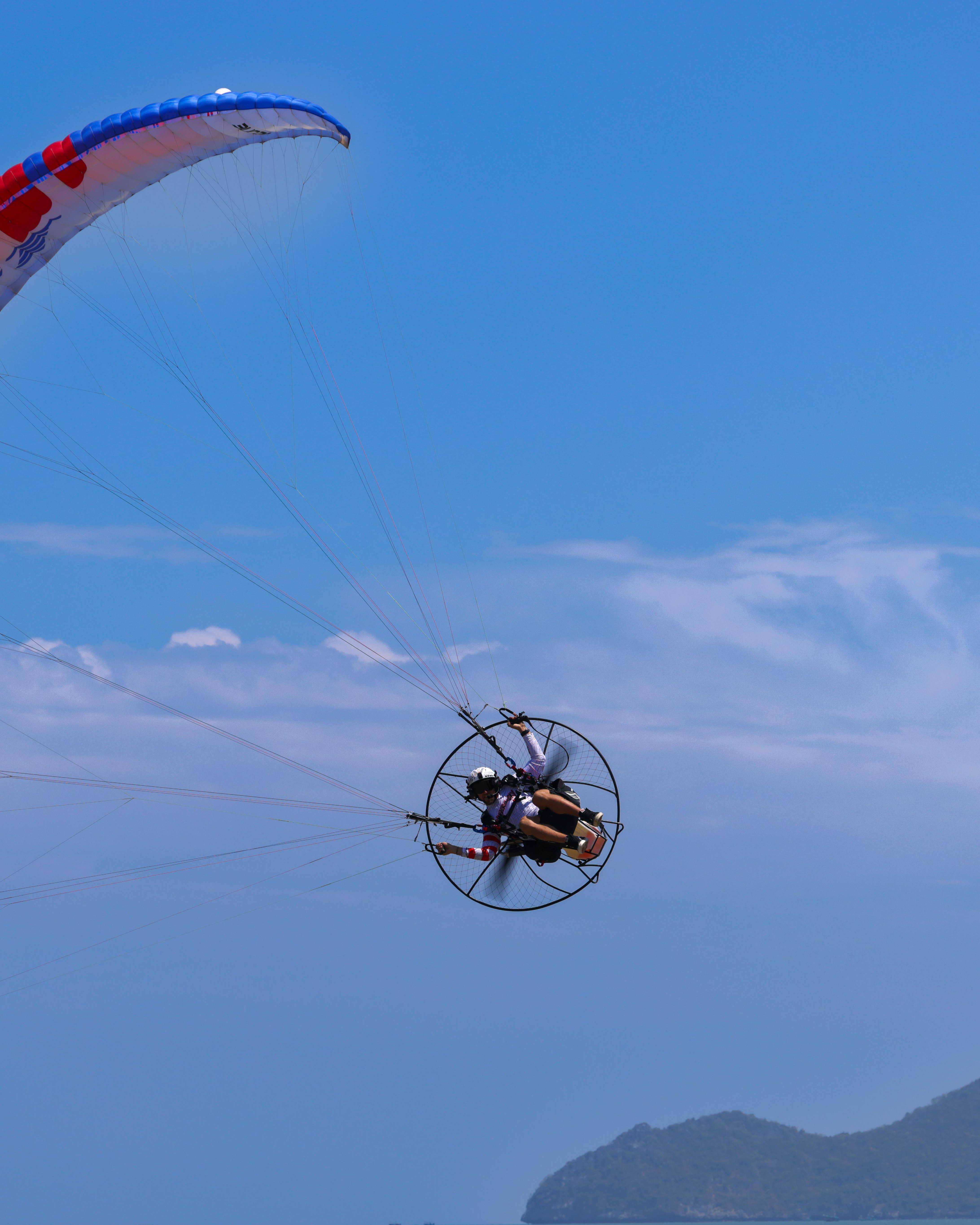 Powered Paragliding Over Coastal Hills