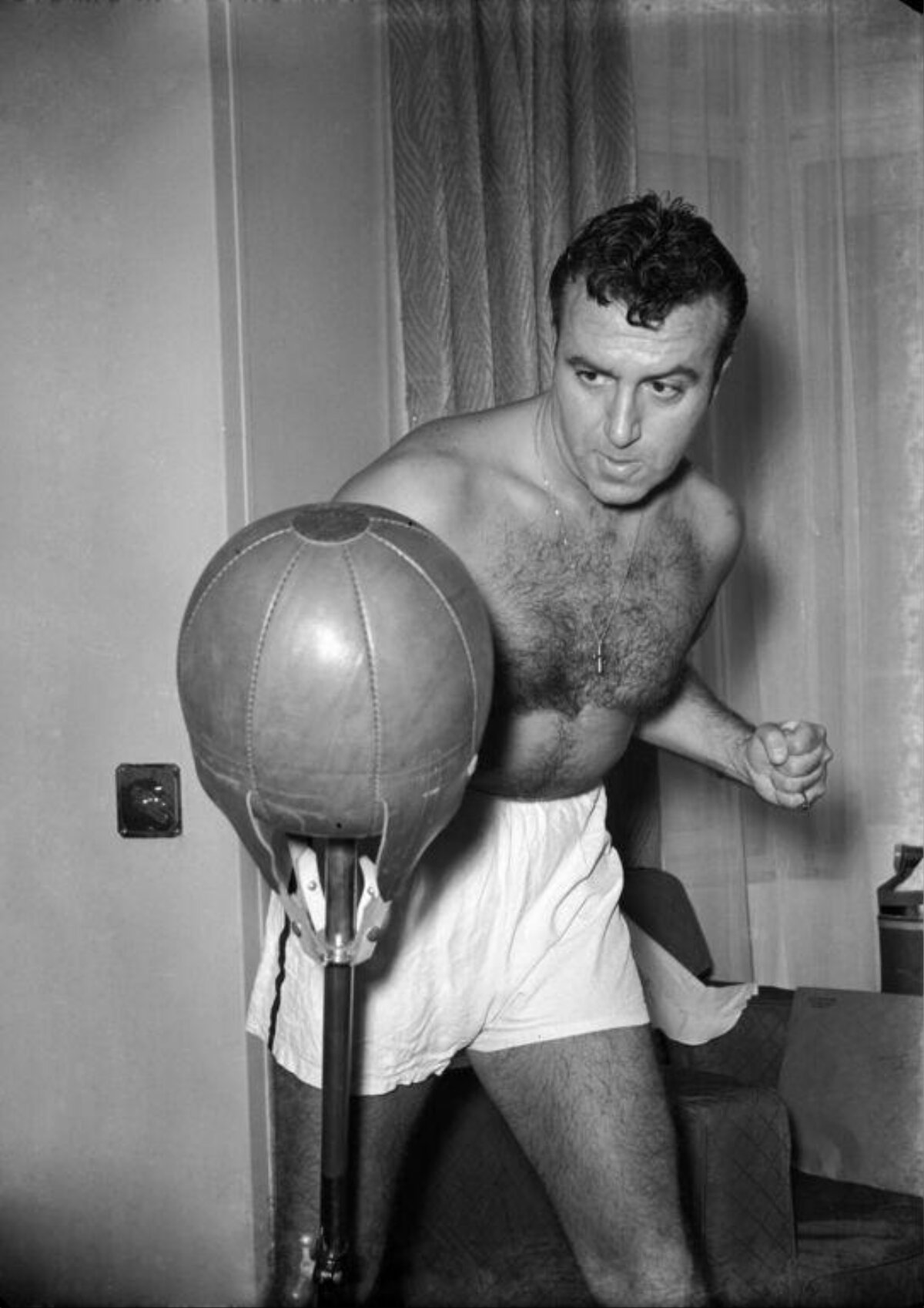Boxer Training With Punching Bag