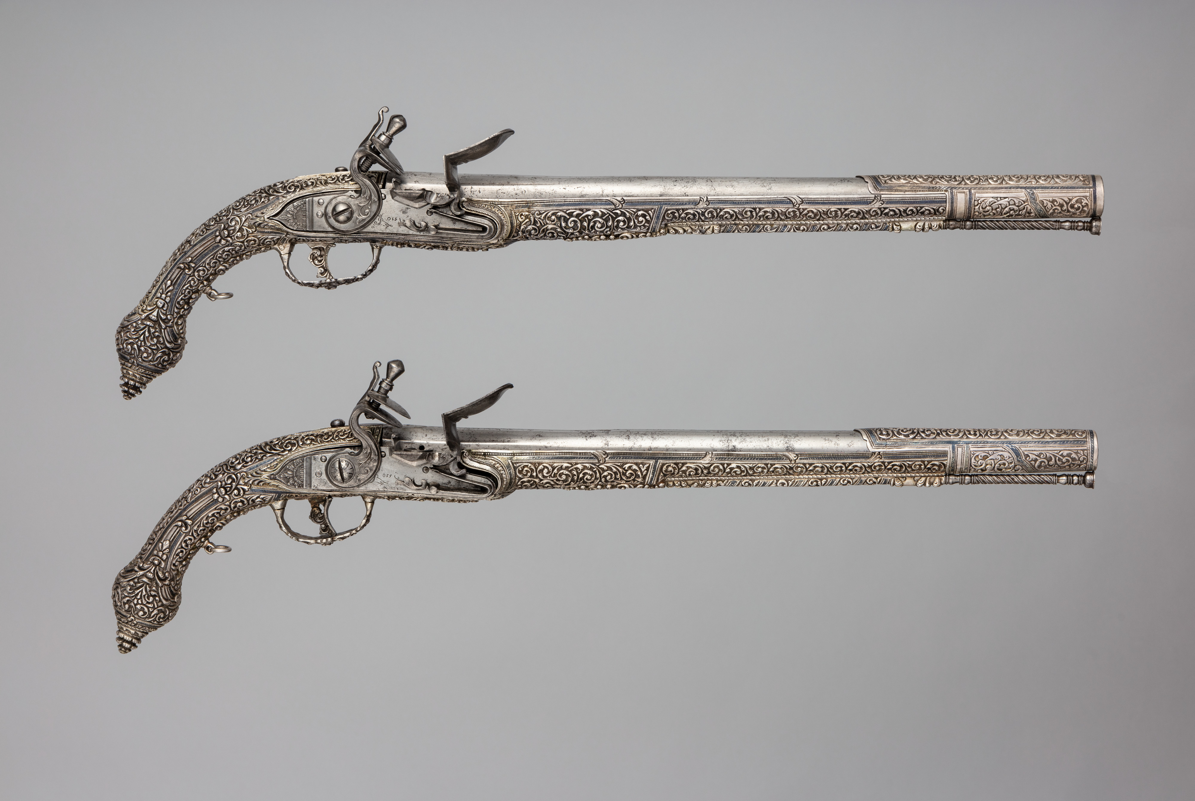 Pair of Ornate Silver Flintlock Pistols