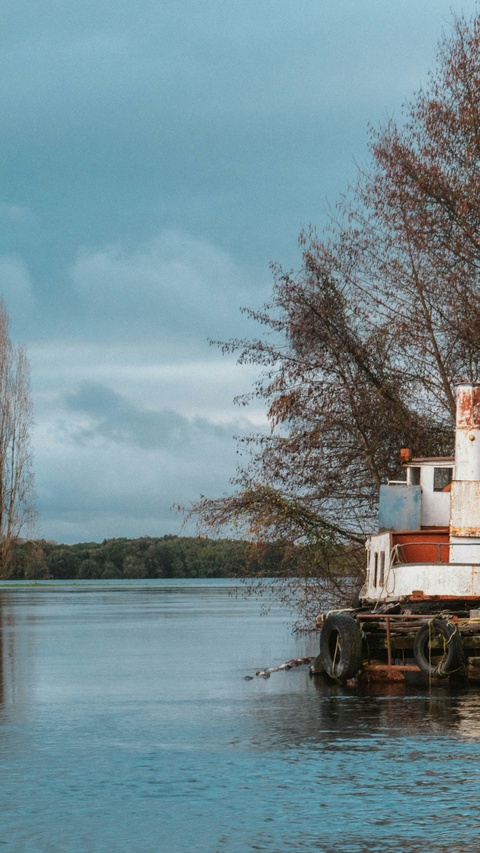 Old Boat Moored on Calm River
