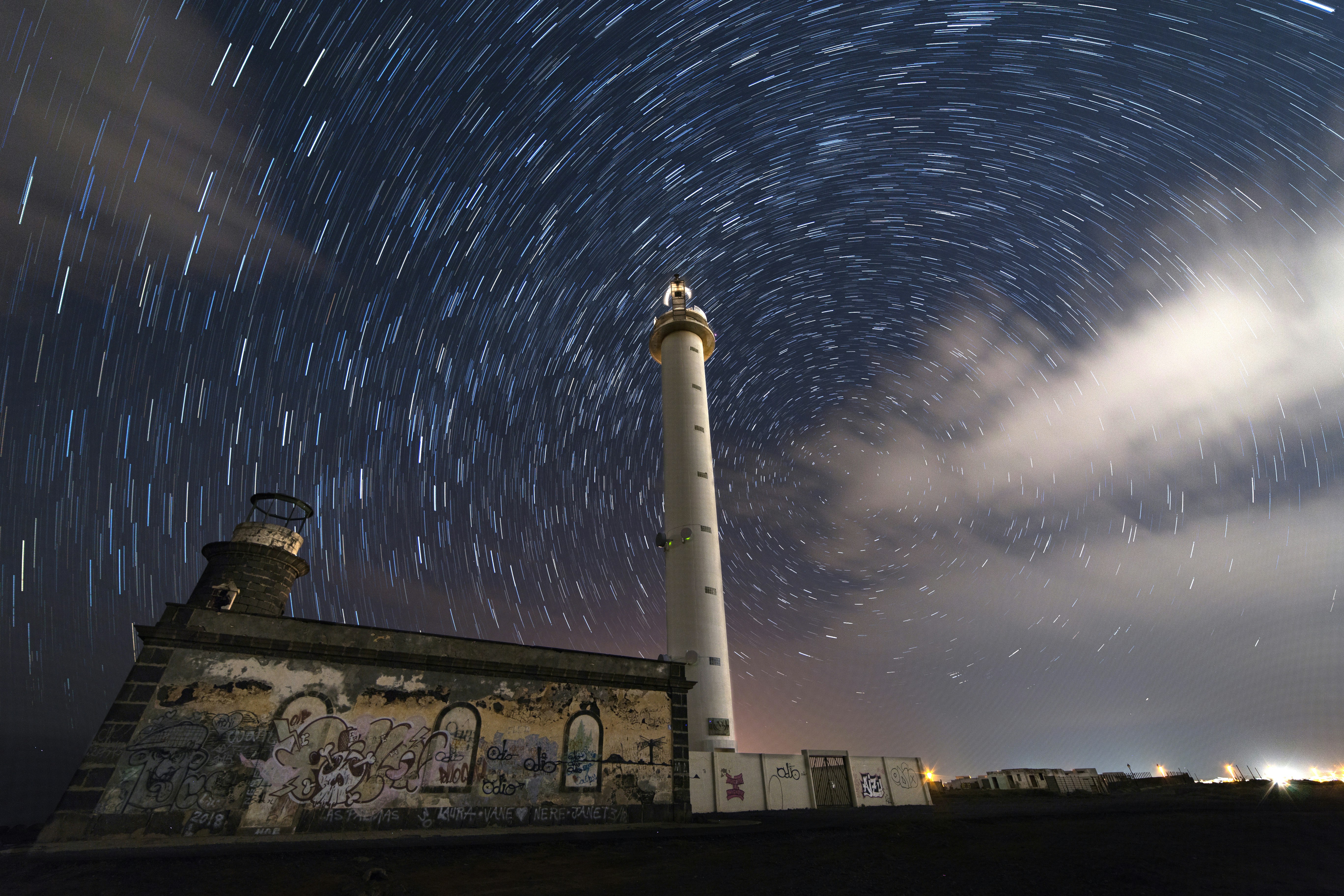 Star Trails Over Lighthouse at Night