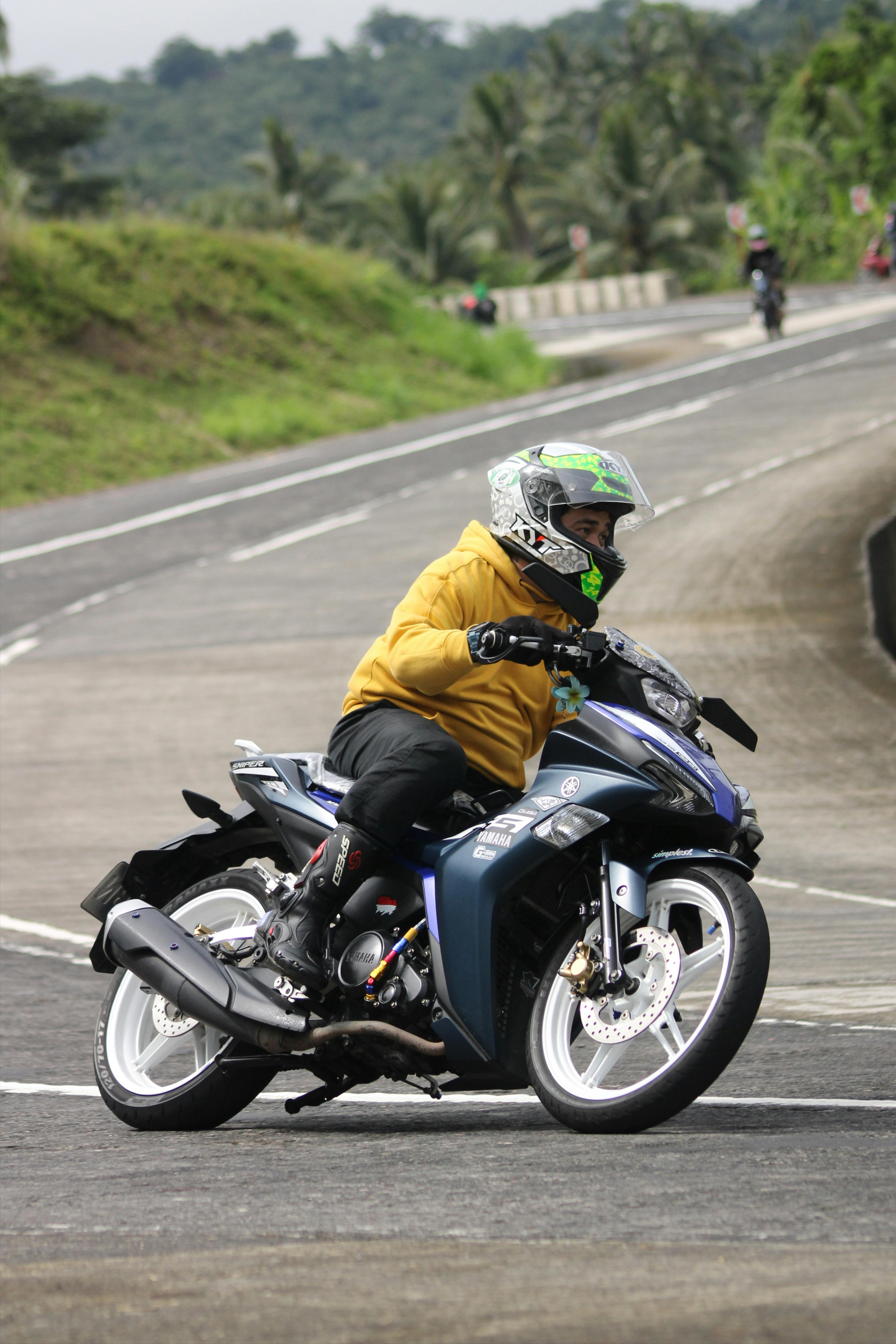 Motorcyclist Leaning Through Road Curve