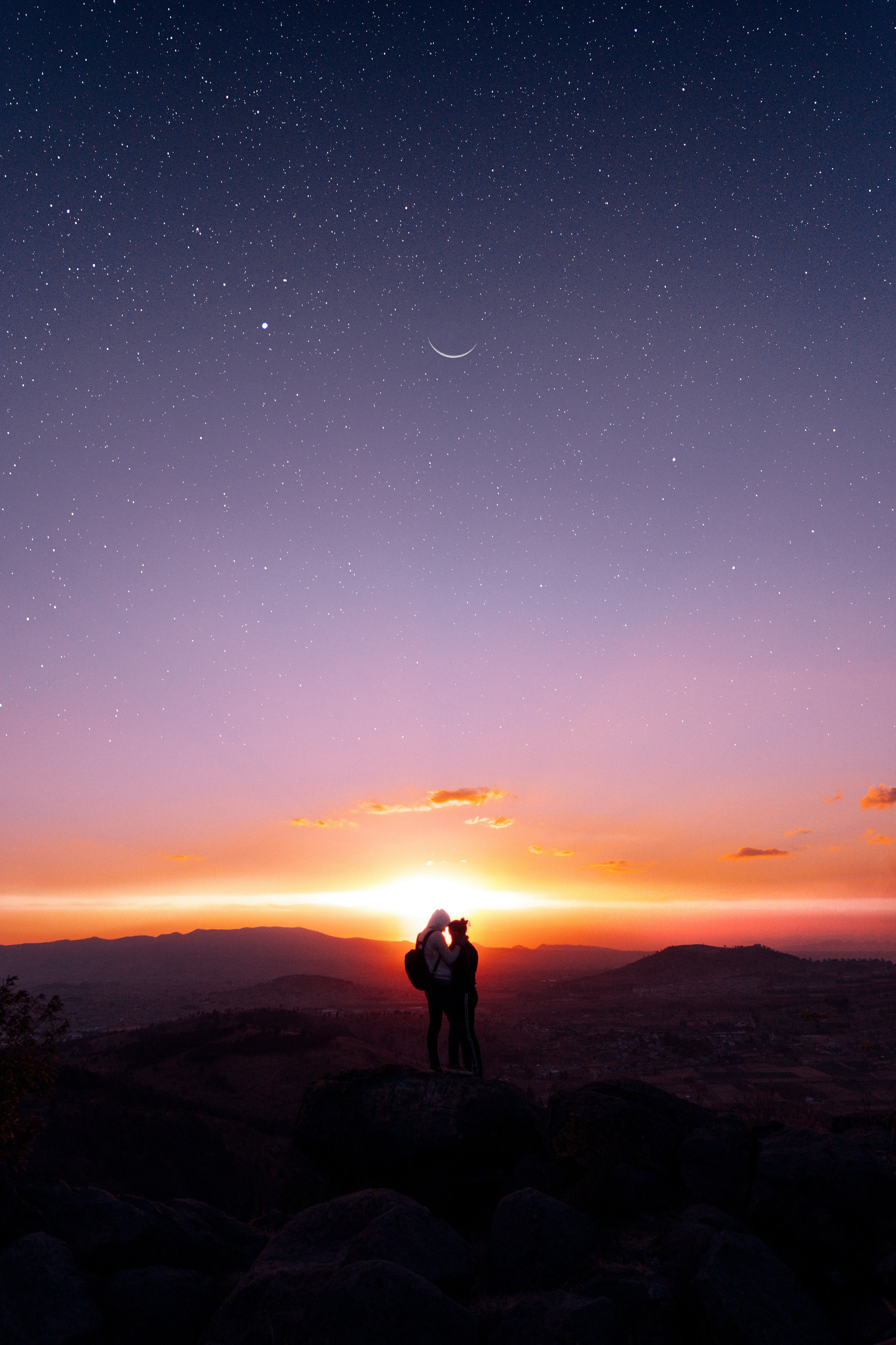 Couple Overlooking Starry Dusk Sky
