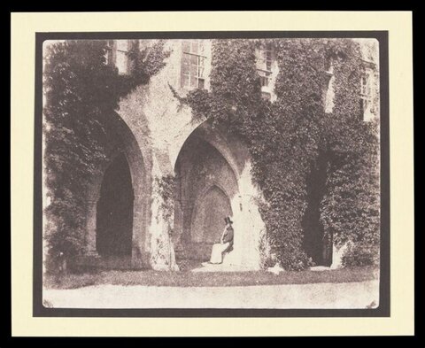 Seated Man at Ivy-covered Cloister