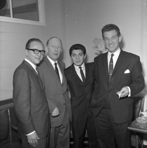 Four Men in Suits Posing for Photo