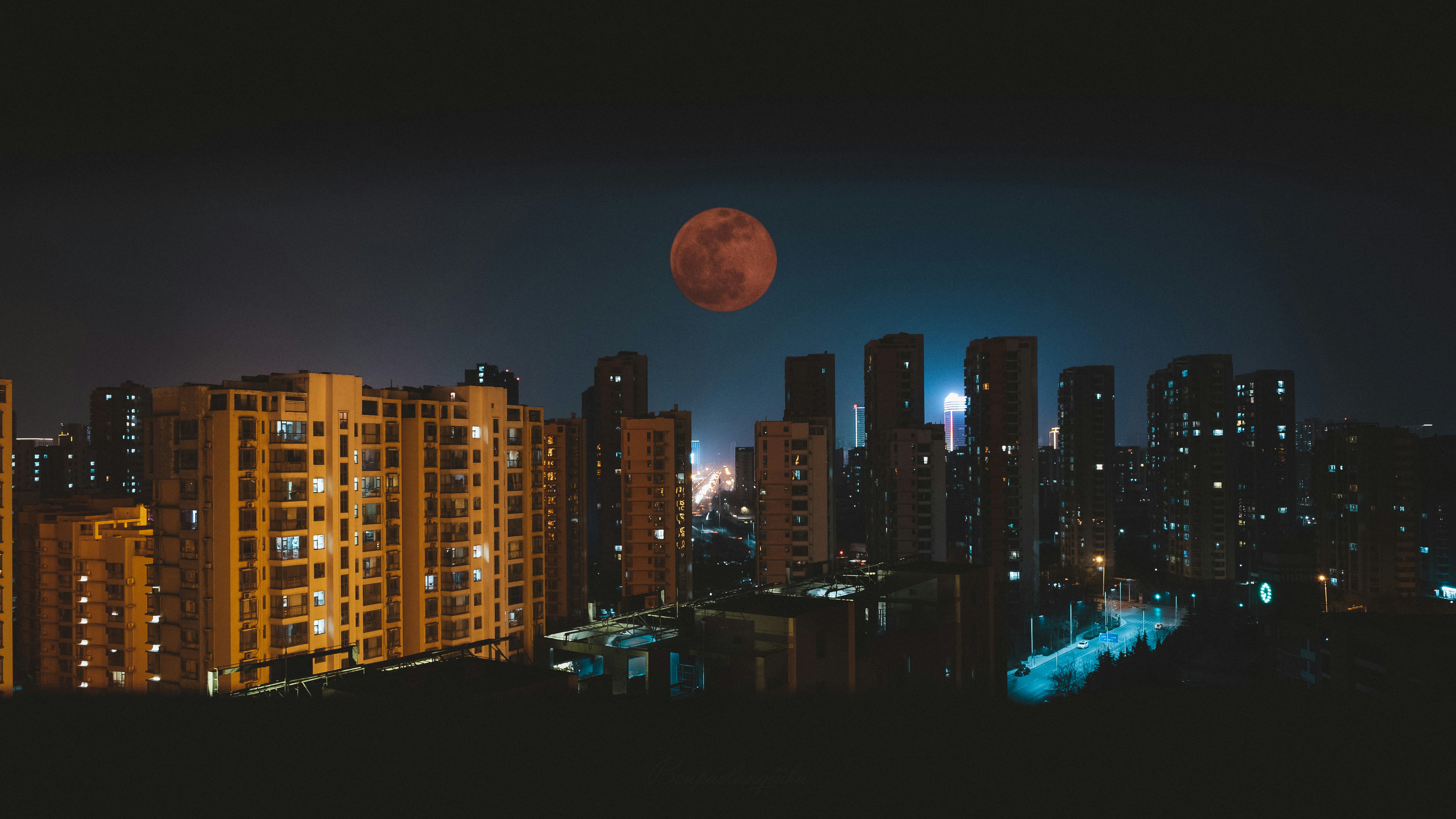 City Night View With Red Moon