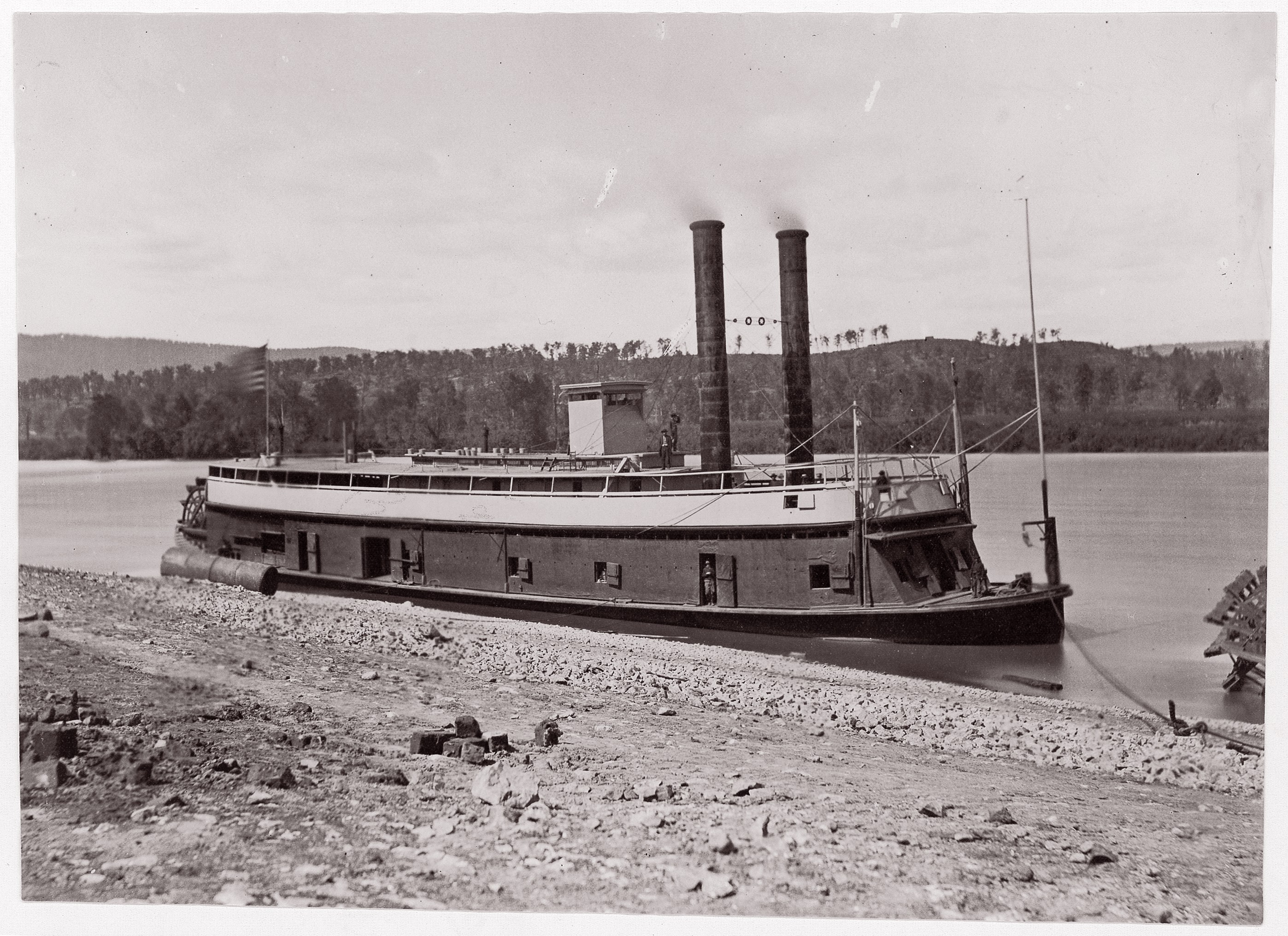 Side-Wheel Steamboat Moored at River Shore
