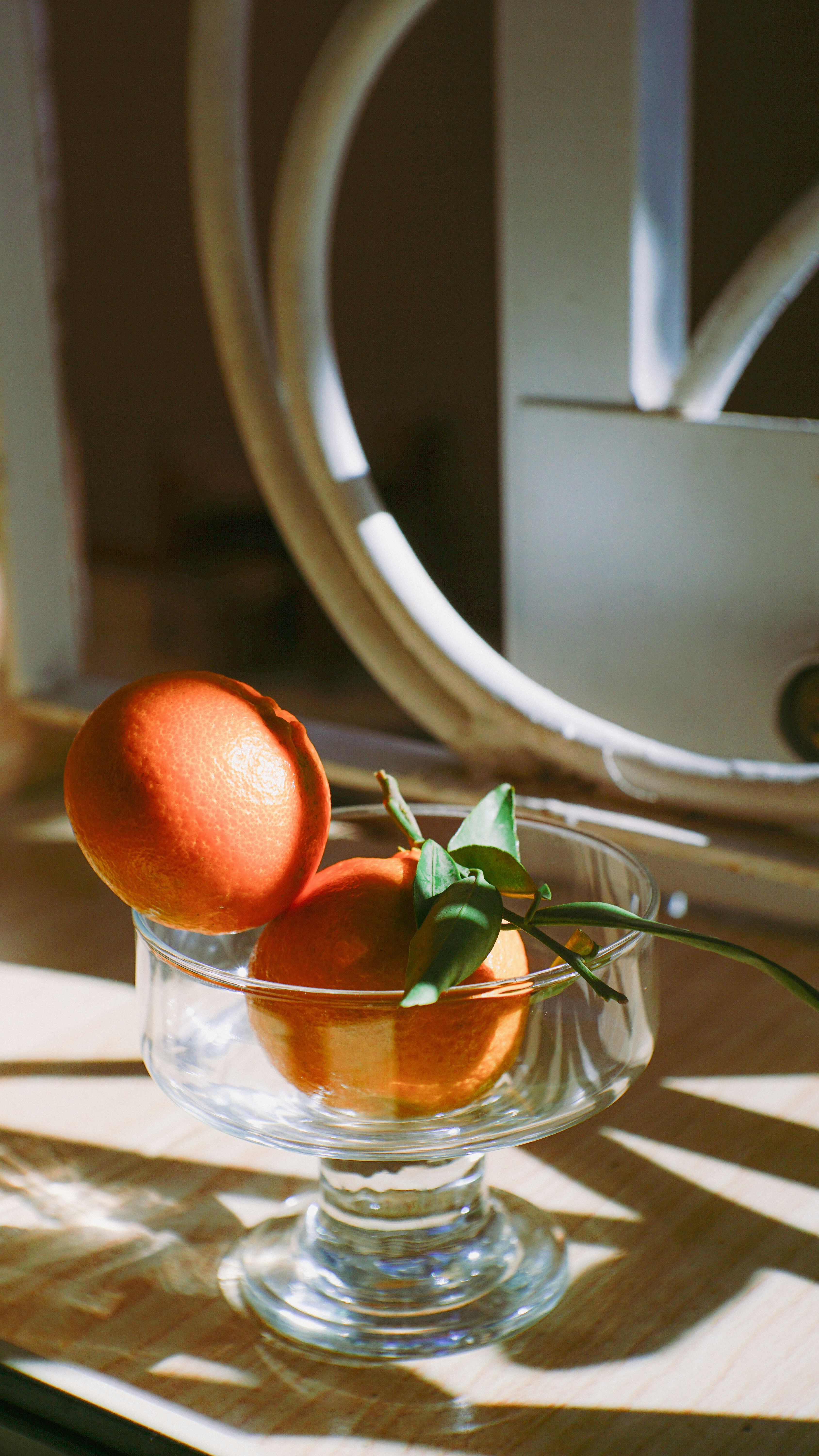 Two Oranges in Glass Bowl
