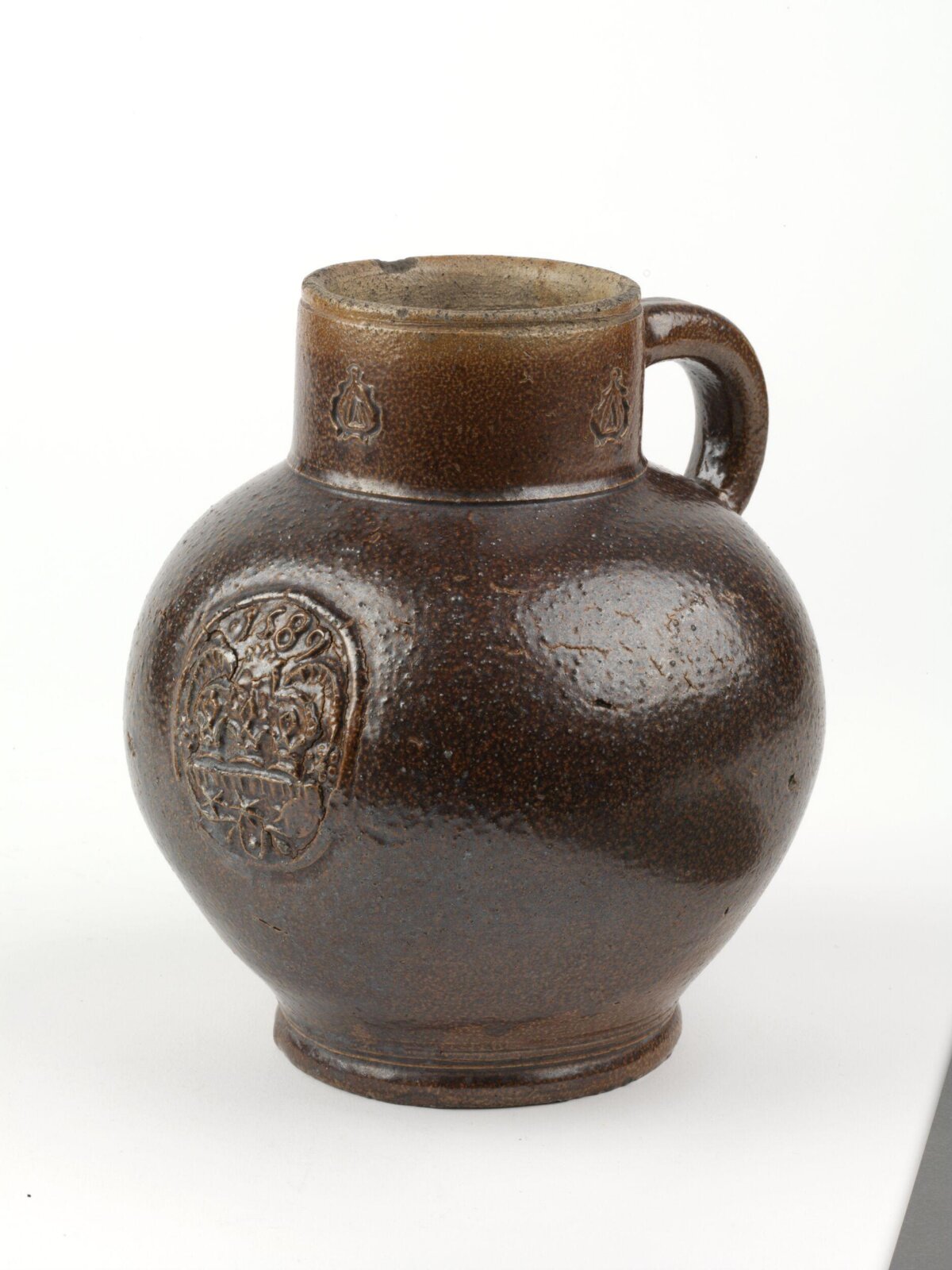 Brown Glazed Stamped Ceramic Jug