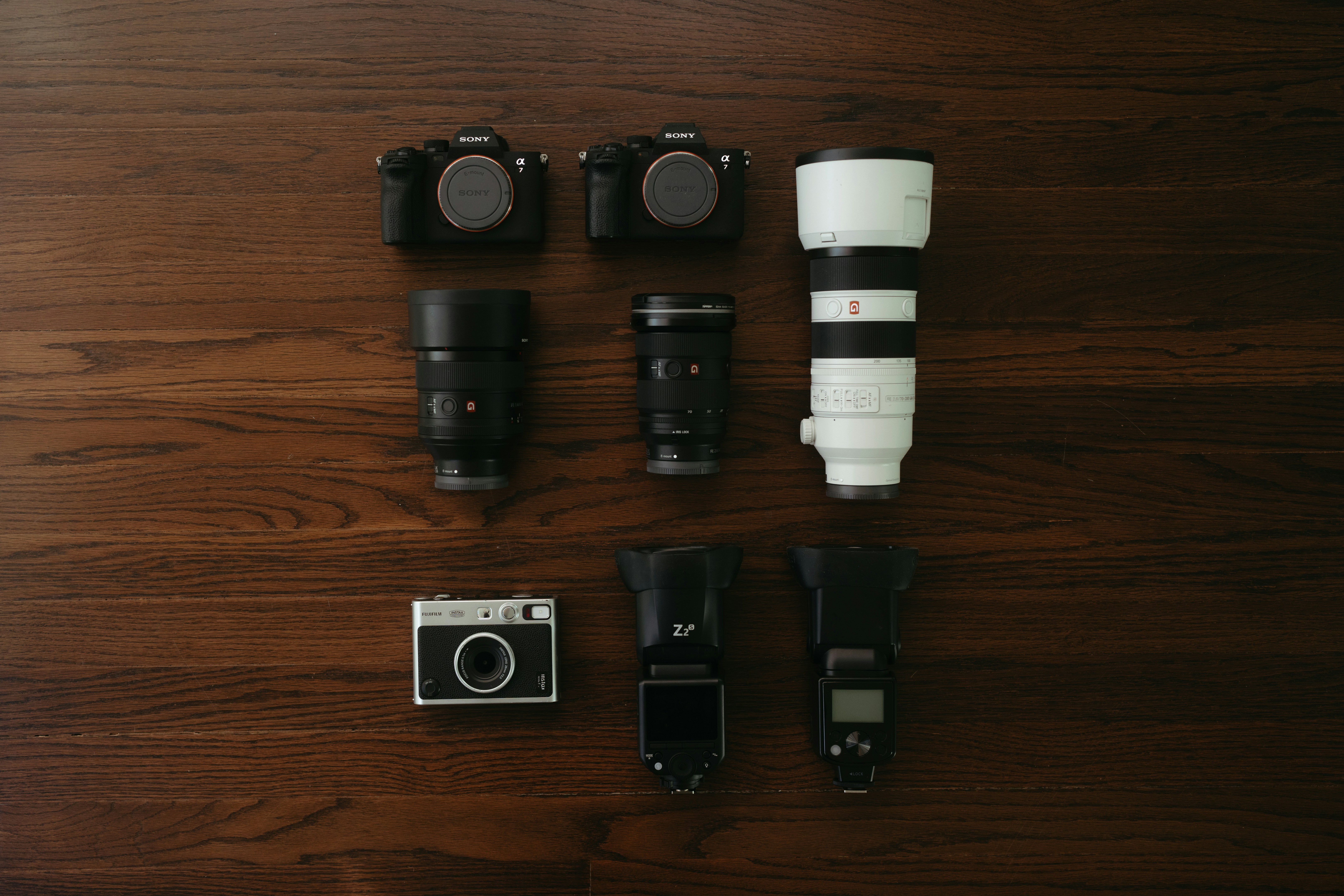 Camera Gear Collection on Wooden Table